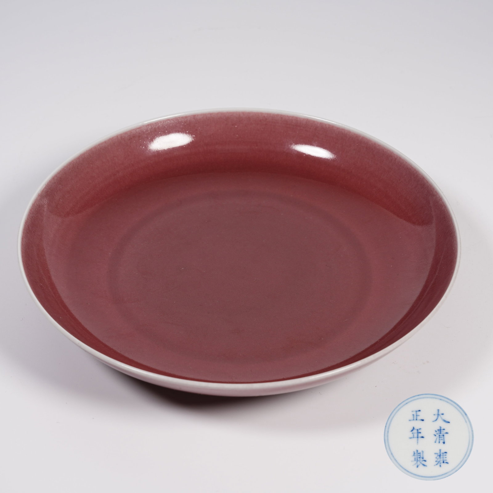 A KIDNEY-BEAN RED GLAZE PLATE: Kidney-bean Red Glaze Plate