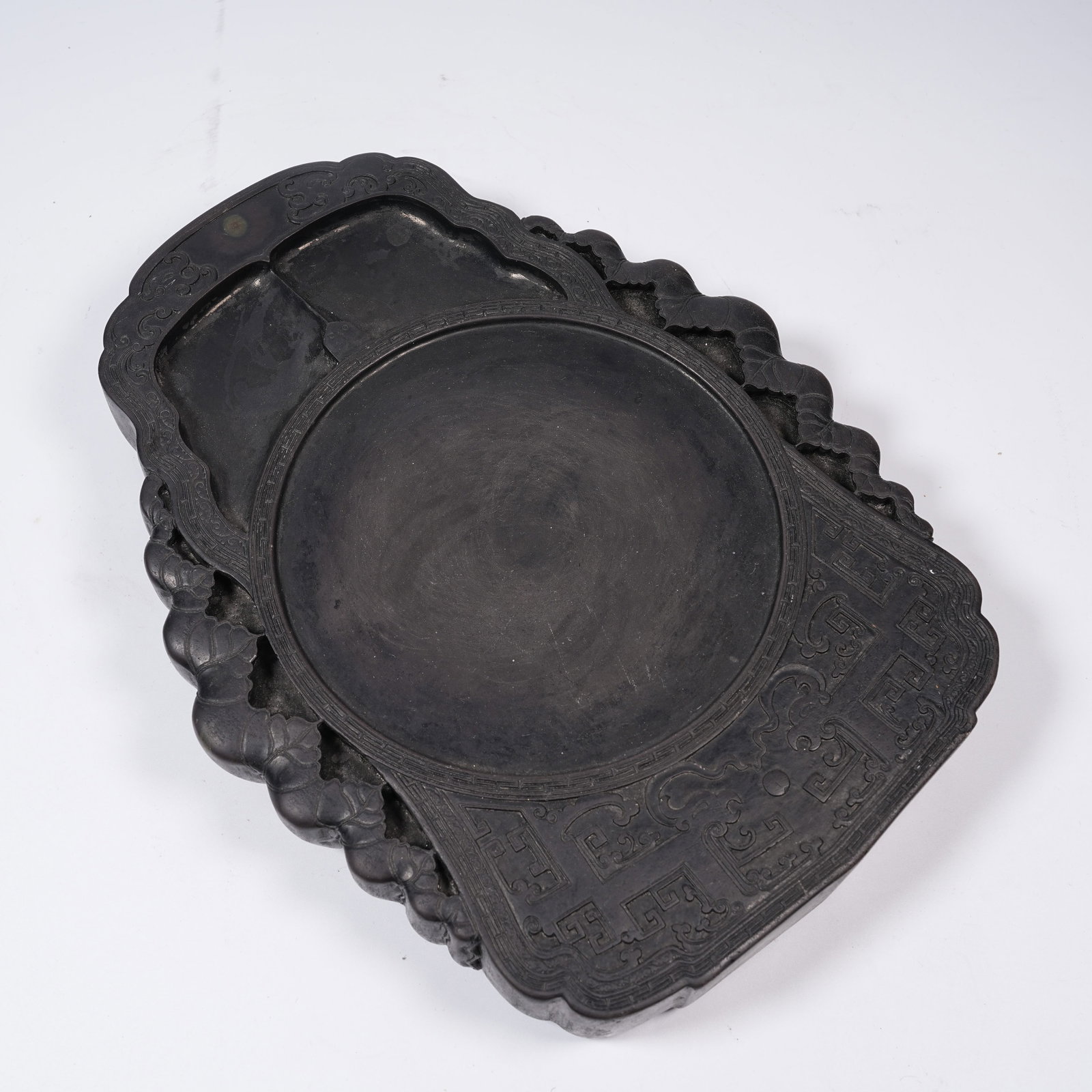 A DUAN STONE COILED DRAGON PATTERN INKSTONE: Duan Stone Coiled Dragon Pattern Inkstone