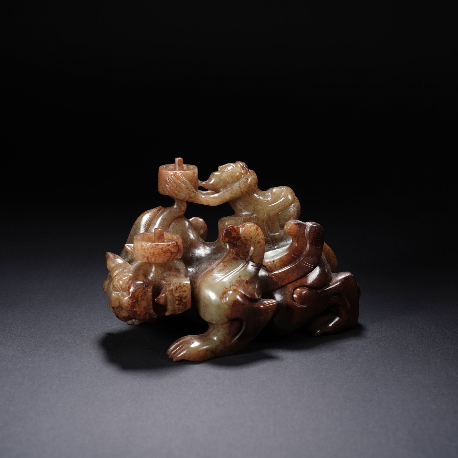 A ANCIENT JADE FIGURE RIDING BEAST INCENSE HOLDER: Ancient jade figure riding beast incense holder