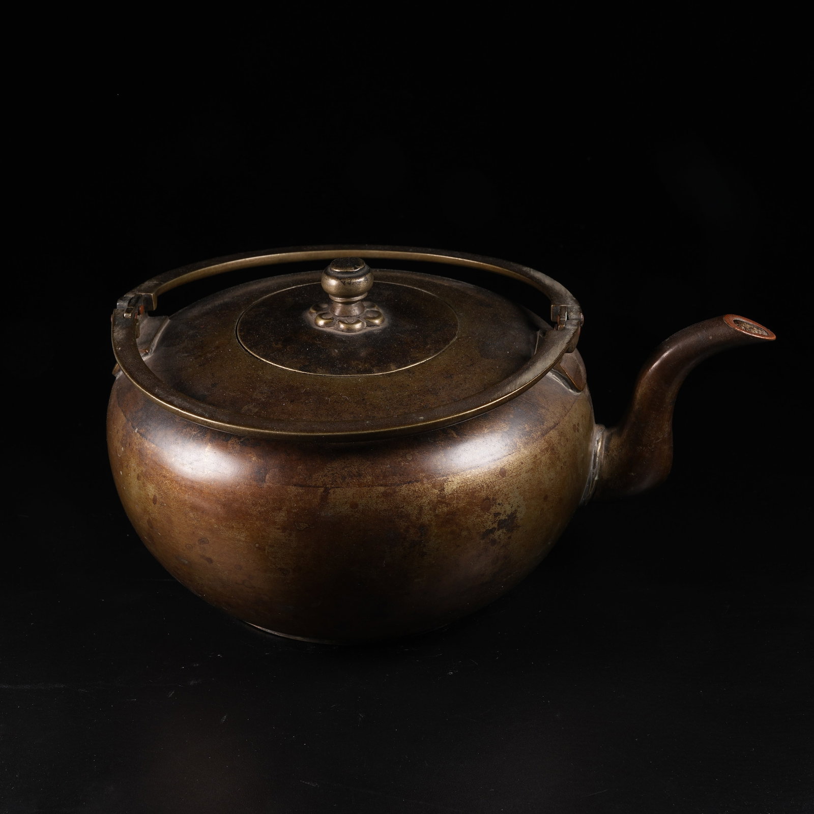 A BRONZE LIDDED EWER WITH HOIST HANDLE: Bronze Lidded Ewer with Hoist Handle
