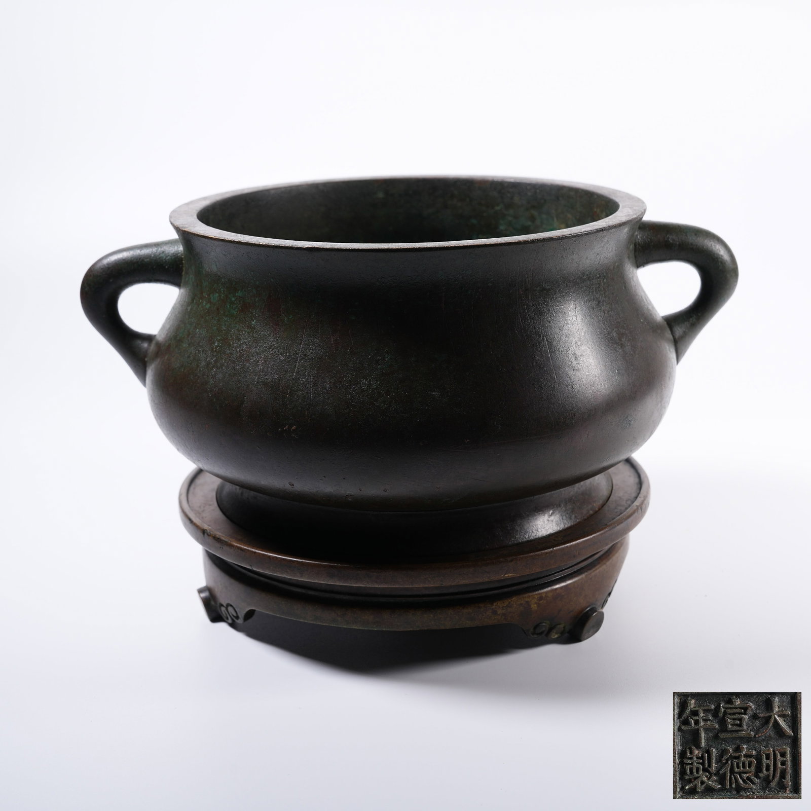 A BRONZE WORM-EARED CENSER: Bronze Worm-eared Censer