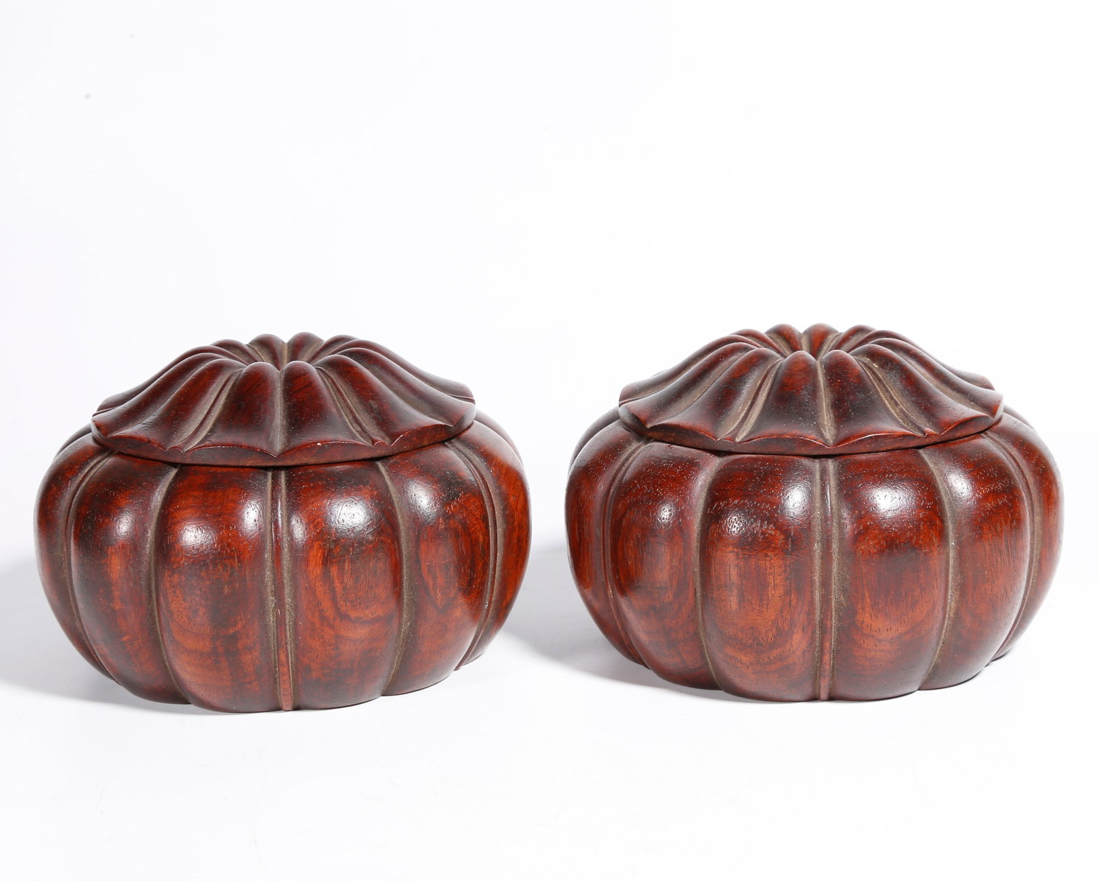 A HUANGHUALI WOOD CARVED GO JAR (PAIR): Huanghuali Wood Carved Go Jar (Pair)