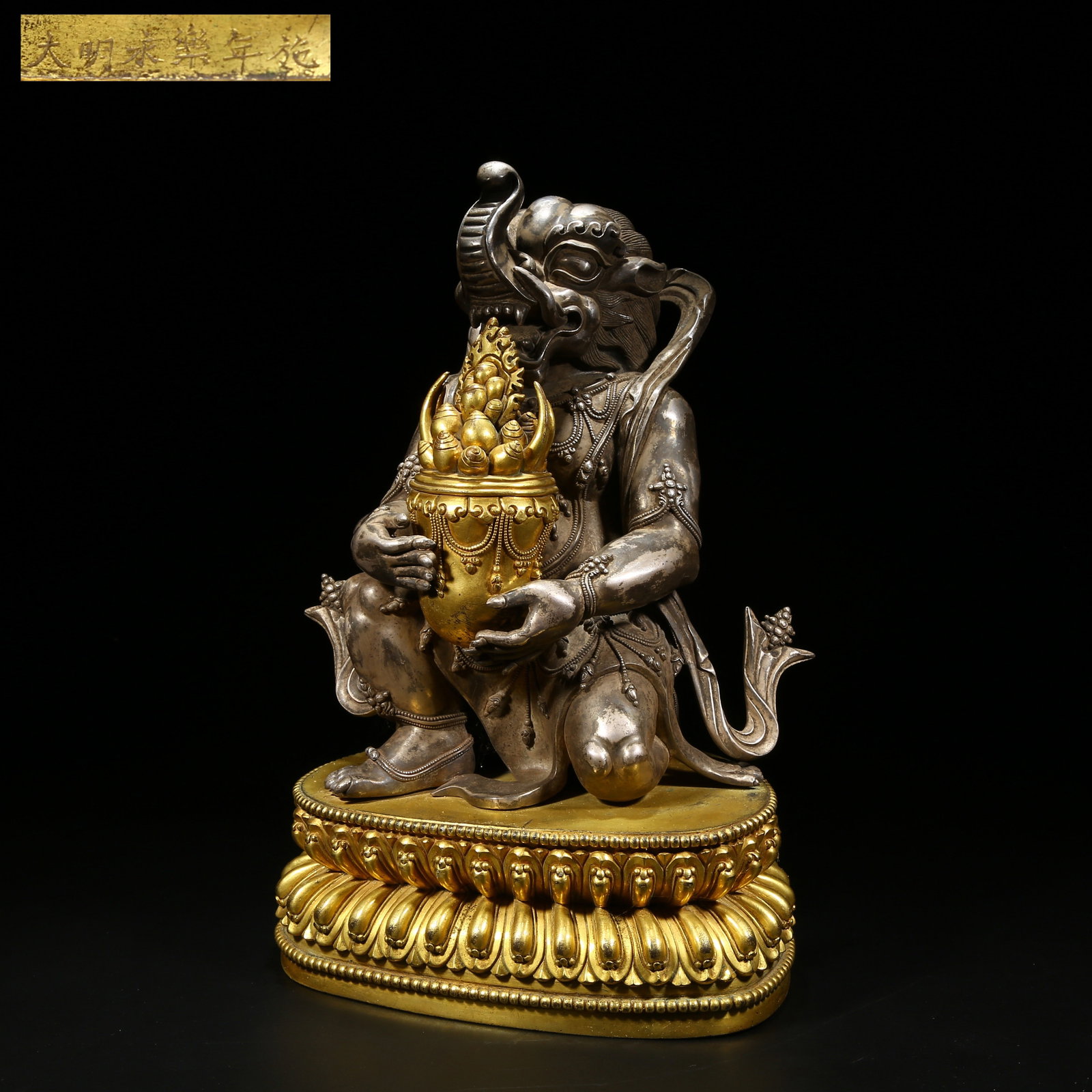 A SILVER GUARDIAN DEITY OF WEALTH STATUE (1 of 9)