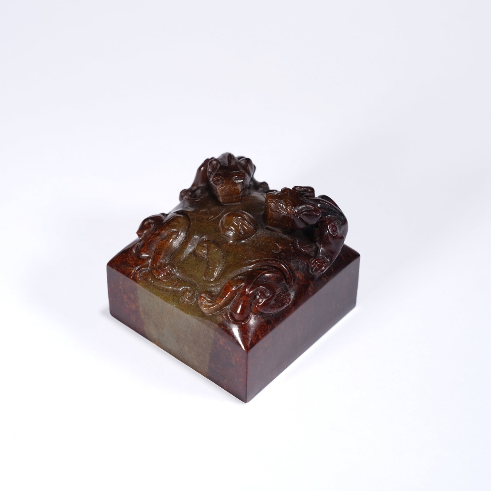 A ANCIENT JADE DRAGON-PLAYING-WITH-PEARL SEAL: Ancient jade dragon-playing-with-pearl seal