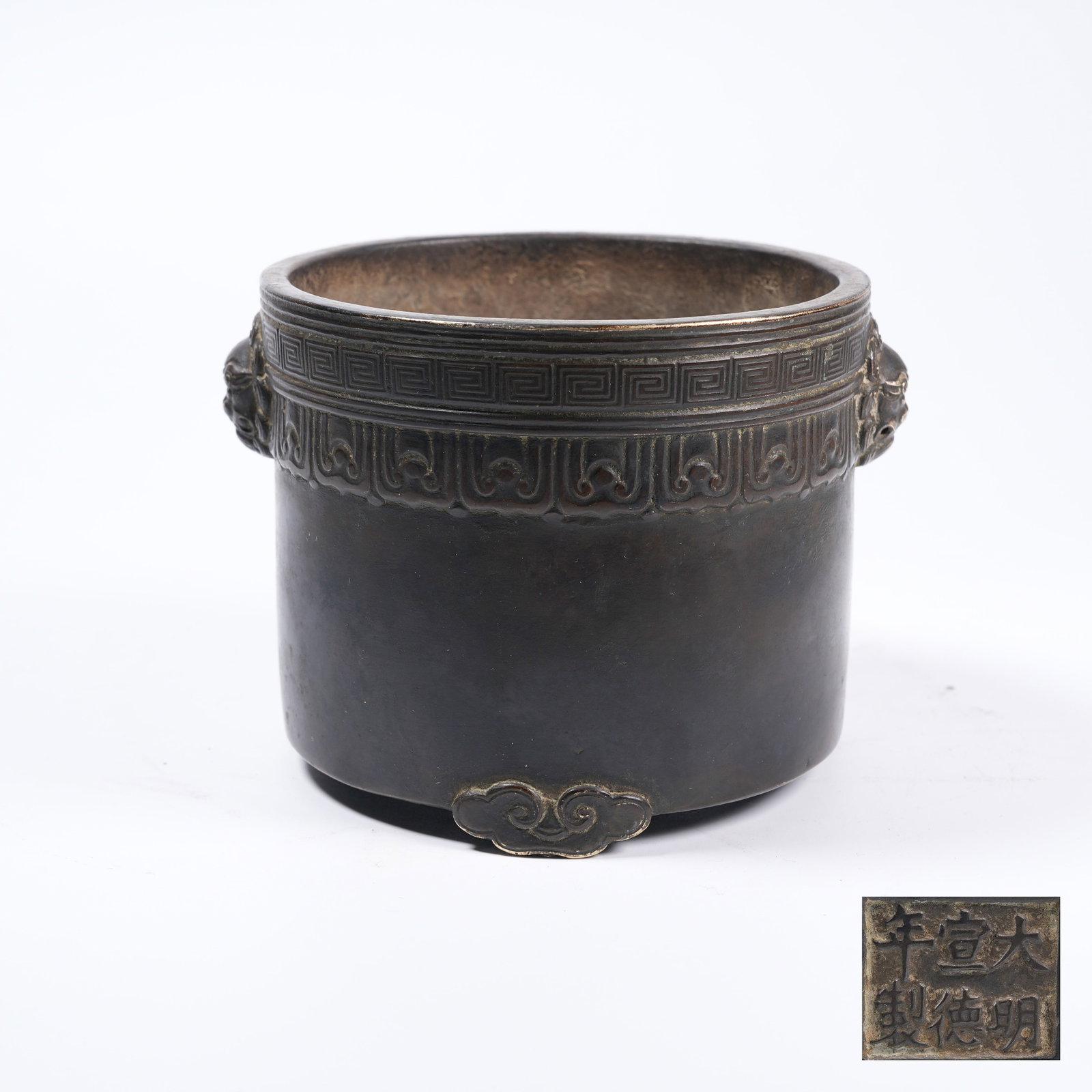 A BRONZE CYLINDRICAL CENSER WITH LION EARS: Bronze Cylindrical Censer with Lion Ears