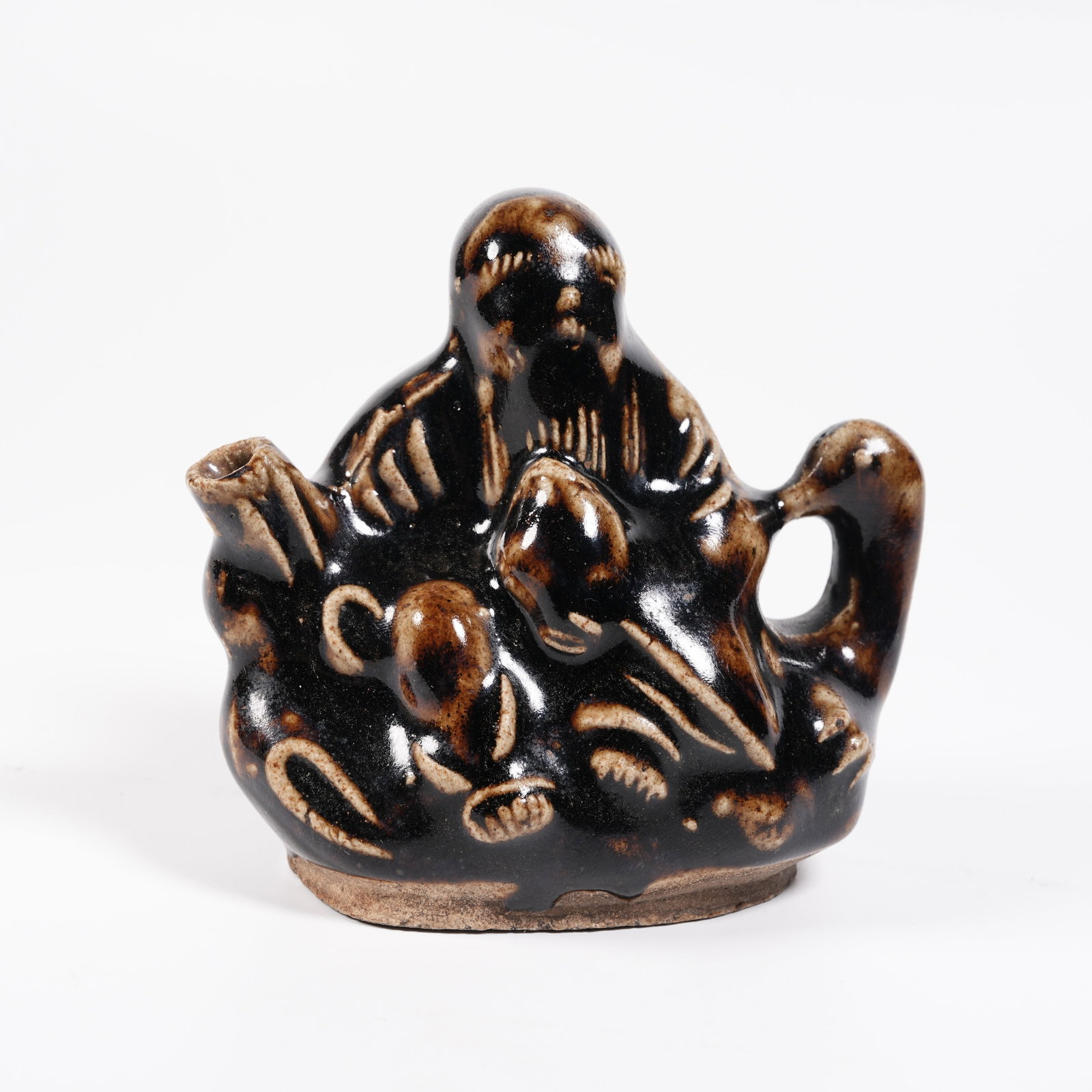 A BROWN GLAZE FIGURE-SHAPED EWER: Brown Glaze Figure-shaped Ewer