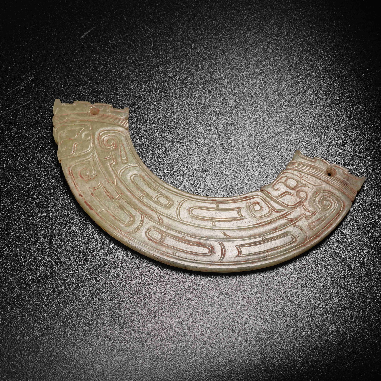 A ANCIENT JADE HUANG WITH DIVINE HUMAN MASK PATTERN: Ancient Jade Huang with Divine Human Mask Pattern