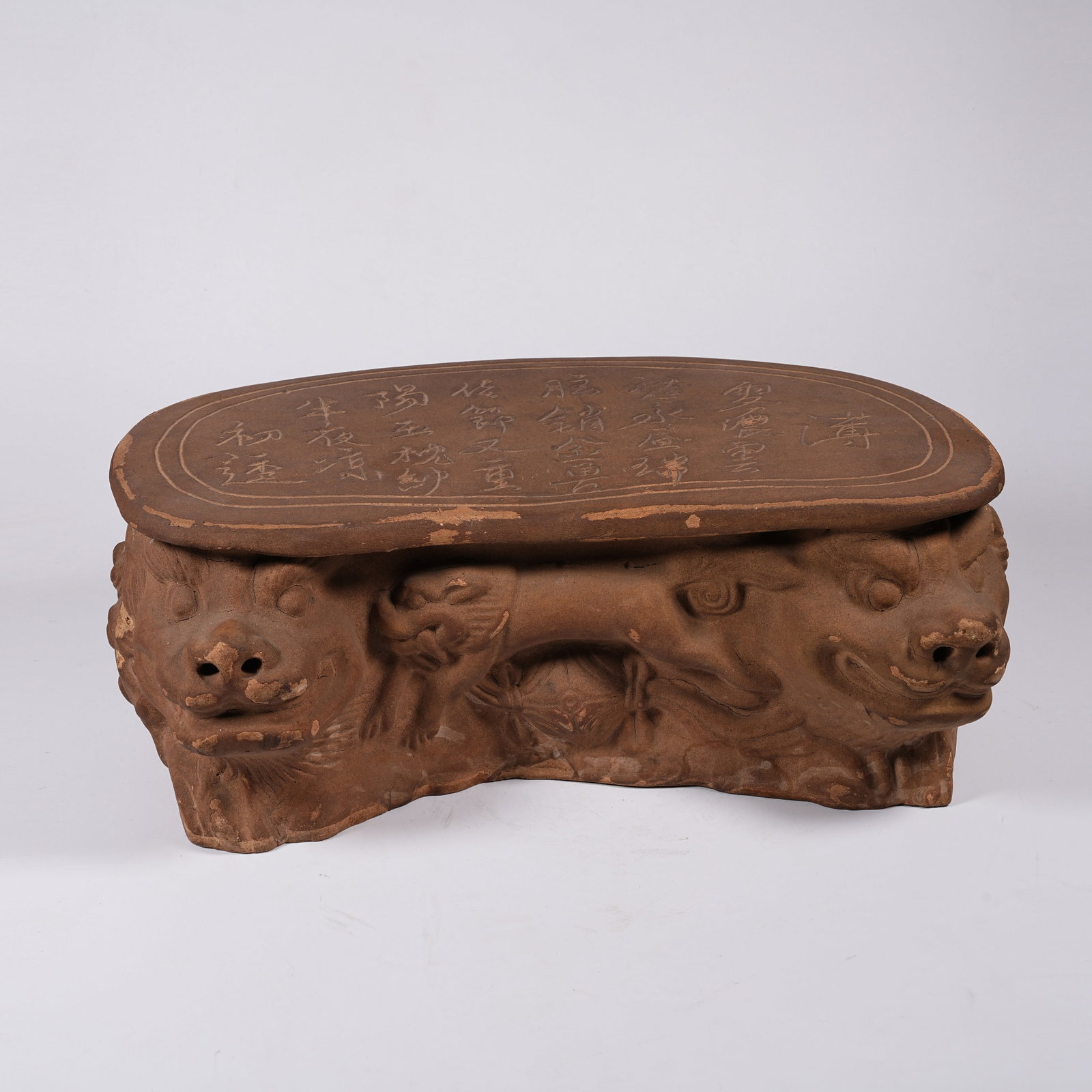A CIZHOU KILN DOUBLE LION PILLOW: Cizhou Kiln Double Lion Pillow