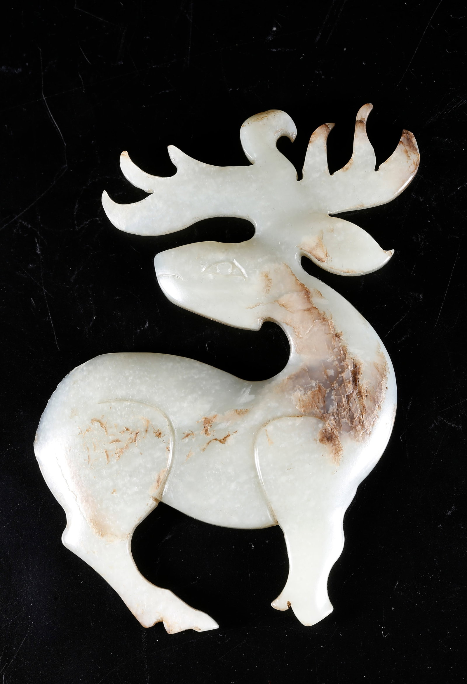 A DEER-SHAPED ORNAMENT CARVED FROM HETIAN JADE: Deer-shaped Ornament Carved from Hetian Jade