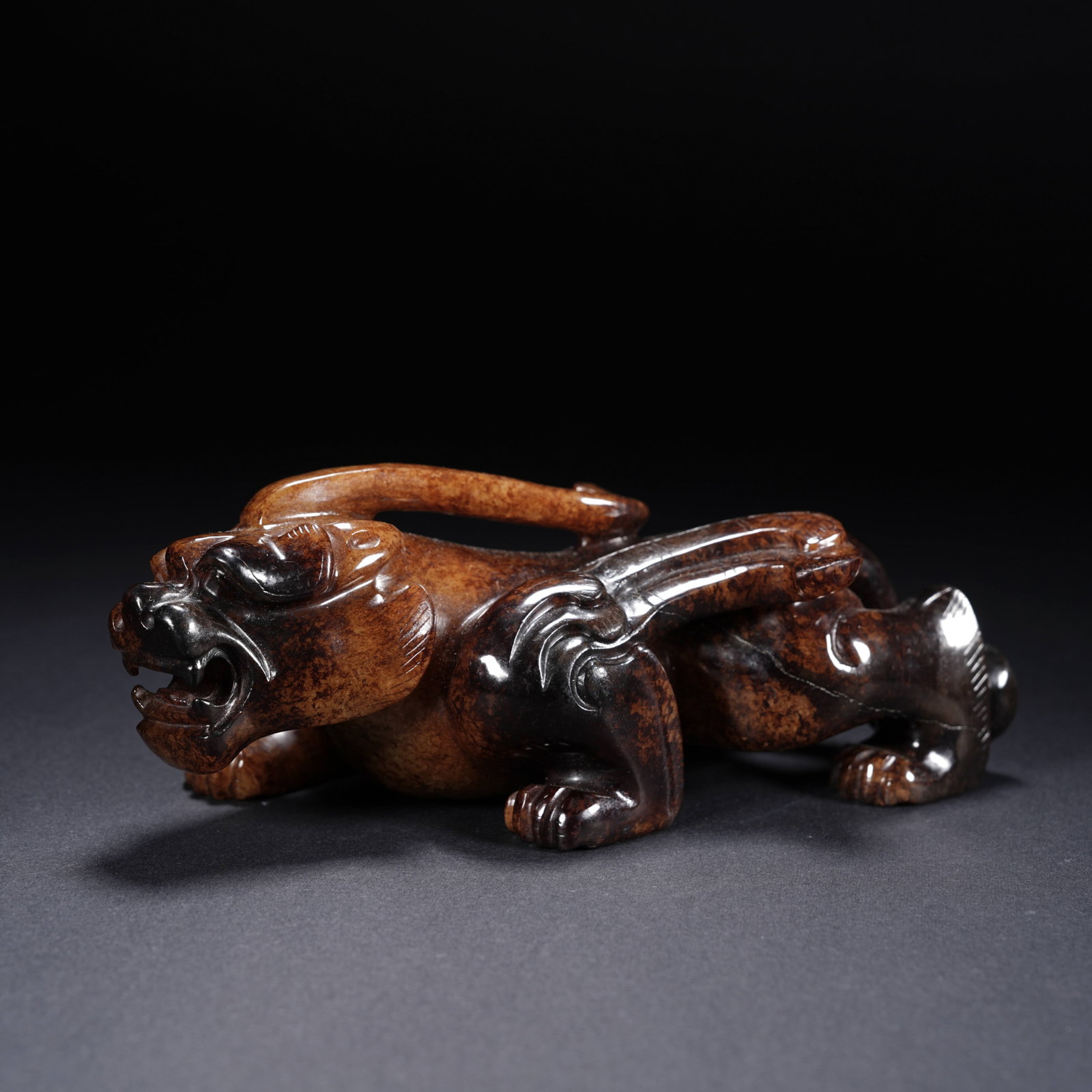 A ANCIENT JADE AUSPICIOUS BEAST ORNAMENT (1 of 7)