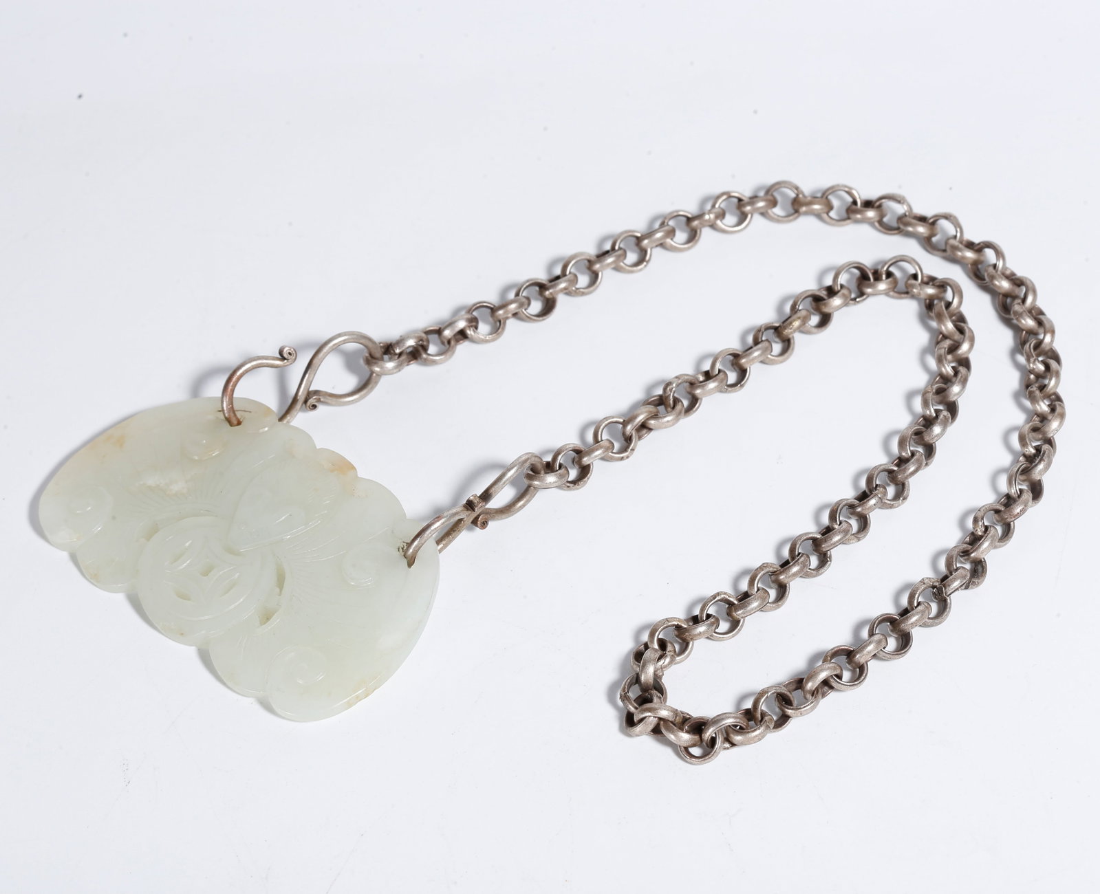A HETIAN JADE PENDANT WITH BLESSING IN SIGHT PATTERN: Hetian Jade Pendant with Blessing in Sight Pattern