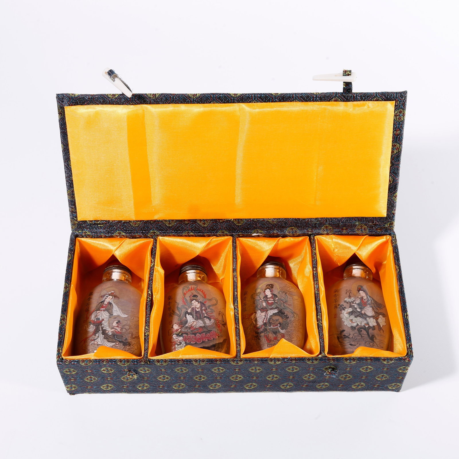 A SET OF COLORED GLAZE GUANYIN PATTERN SNUFF BOTTLES (1 of 10)