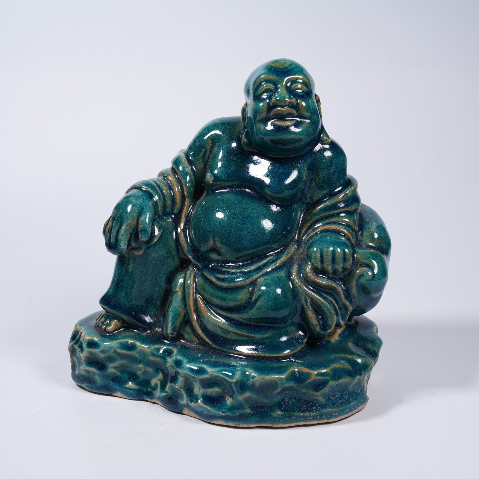 A CELADON SEATED MAITREYA STATUE (1 of 9)