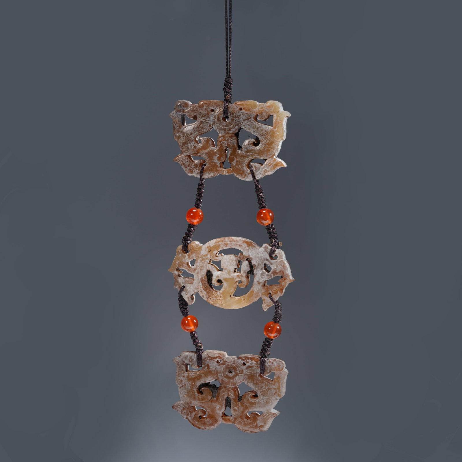 A ANCIENT JADE OPENWORK CHI-DRAGON PENDANT SET (SET) (1 of 9)