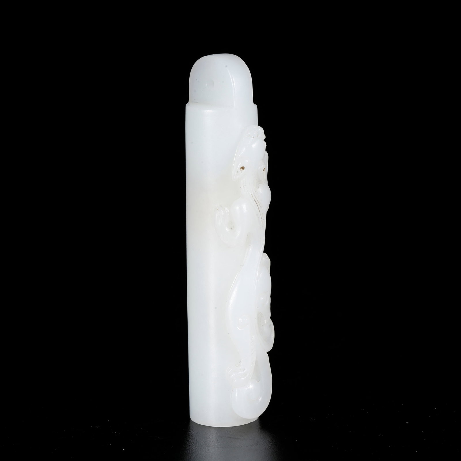 A HETIAN JADE LEZI BEAD CARVED WITH DRAGON PATTERN: Hetian Jade Lezi Bead Carved with Dragon Pattern