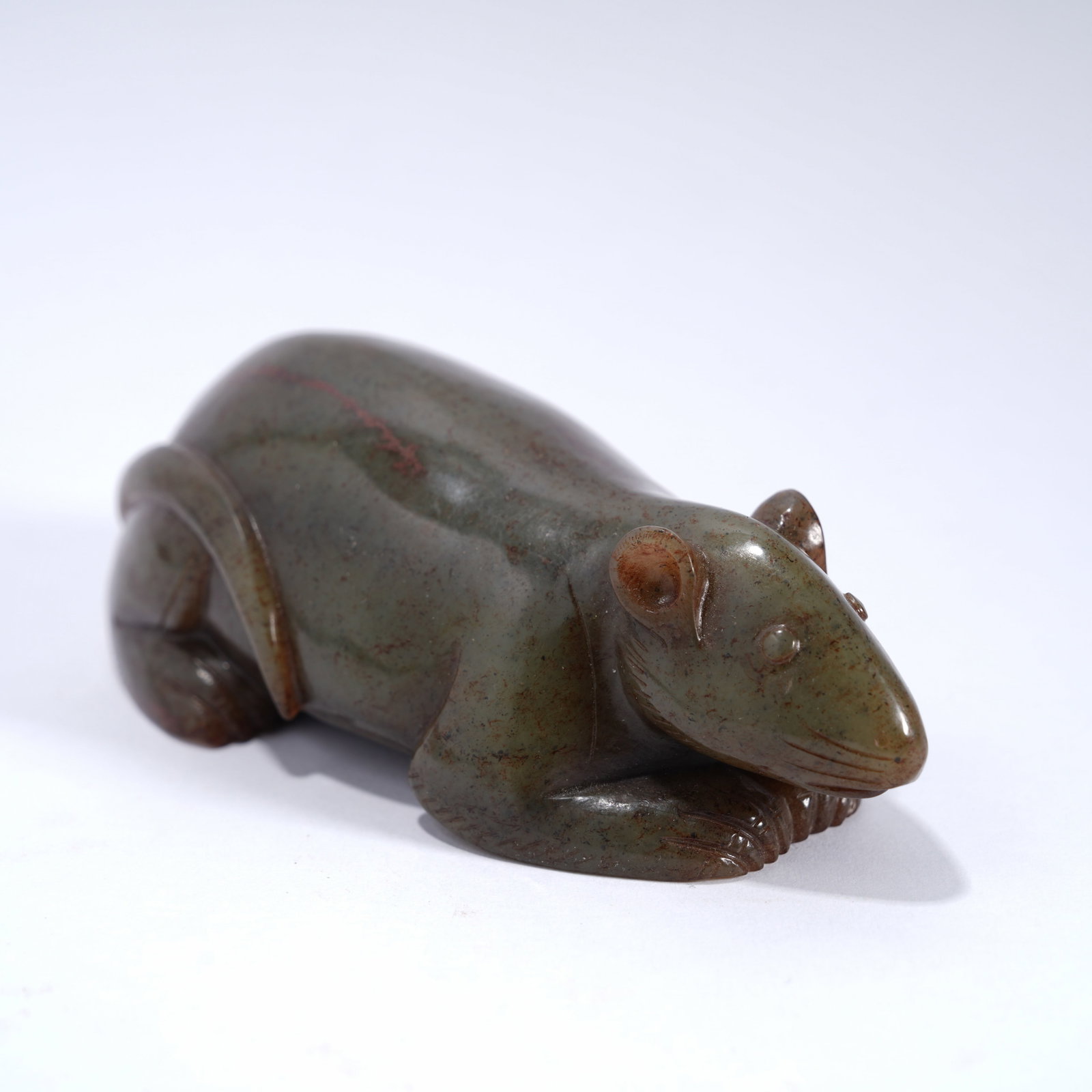A ANCIENT JADE RECUMBENT BEAST ORNAMENT: Ancient jade recumbent beast ornament