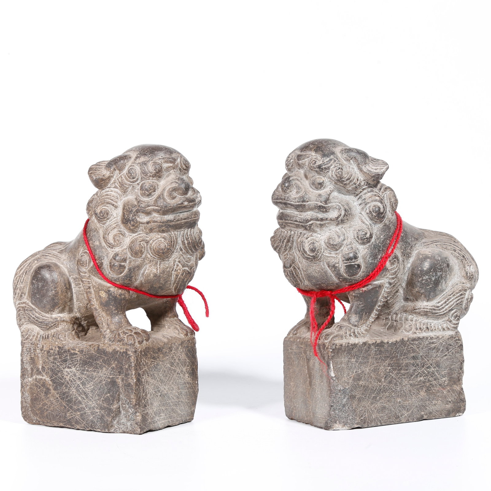 A PAIR OF STONE LION ORNAMENTS: Pair of Stone Lion Ornaments