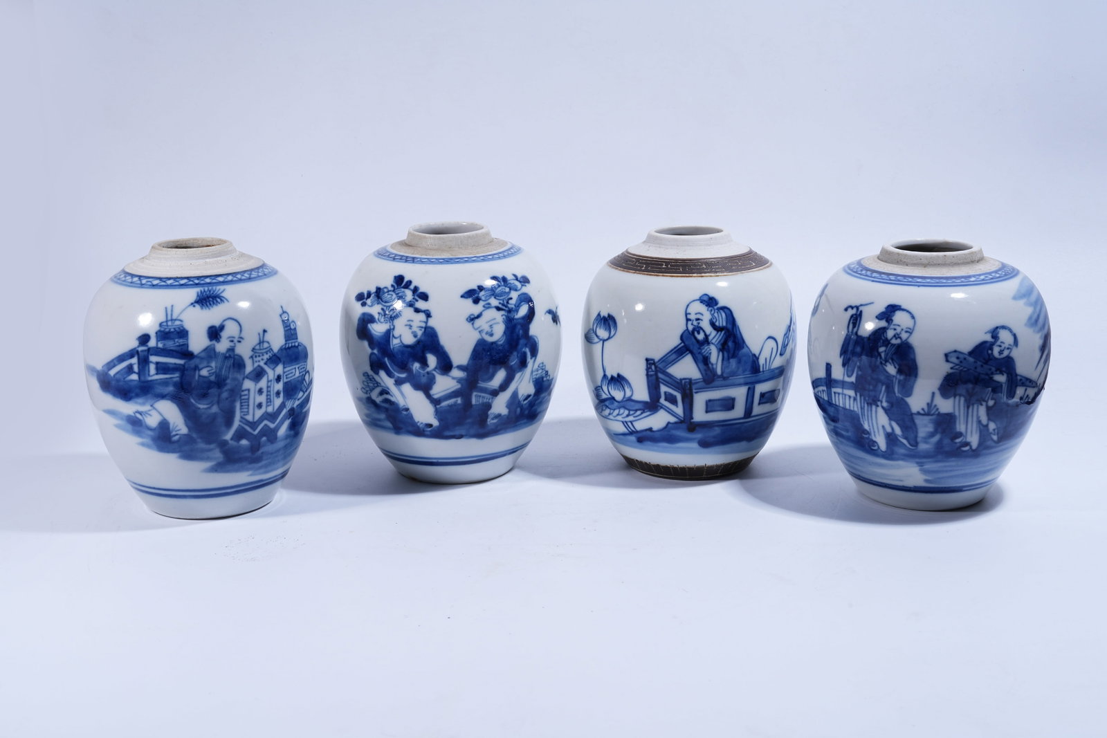 A SET OF FOUR BLUE AND WHITE JARS WITH FIGURE STORY PATTERN: Set of Four Blue and White Jars with Figure Story Pattern