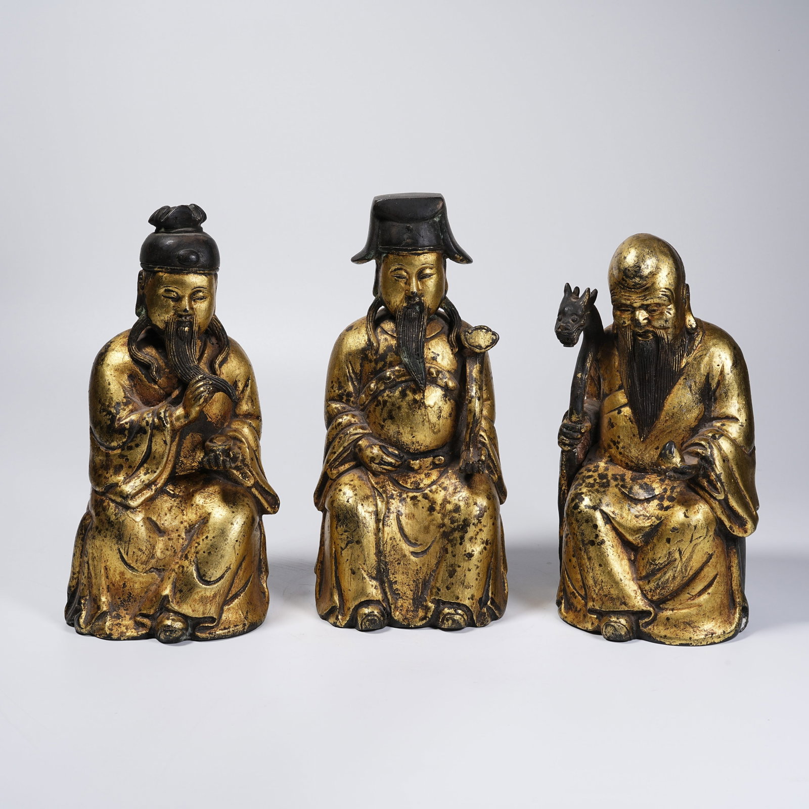 A SET OF GILT BRONZE FORTUNE, LONGEVITY AND BLESSING STATUES (1 of 11)