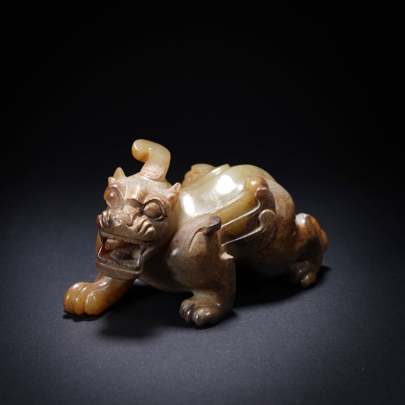A ANCIENT JADE AUSPICIOUS BEAST ORNAMENT (1 of 8)