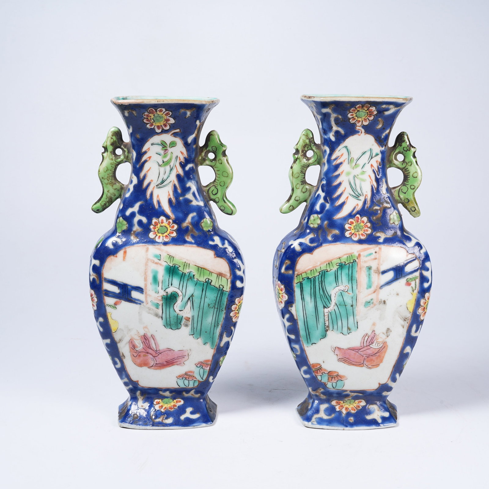 A SET OF SAPPHIRE-BLUE GROUND OPEN-WINDOW FIGURE STORY PATTERN DISC VASES (1 of 11)
