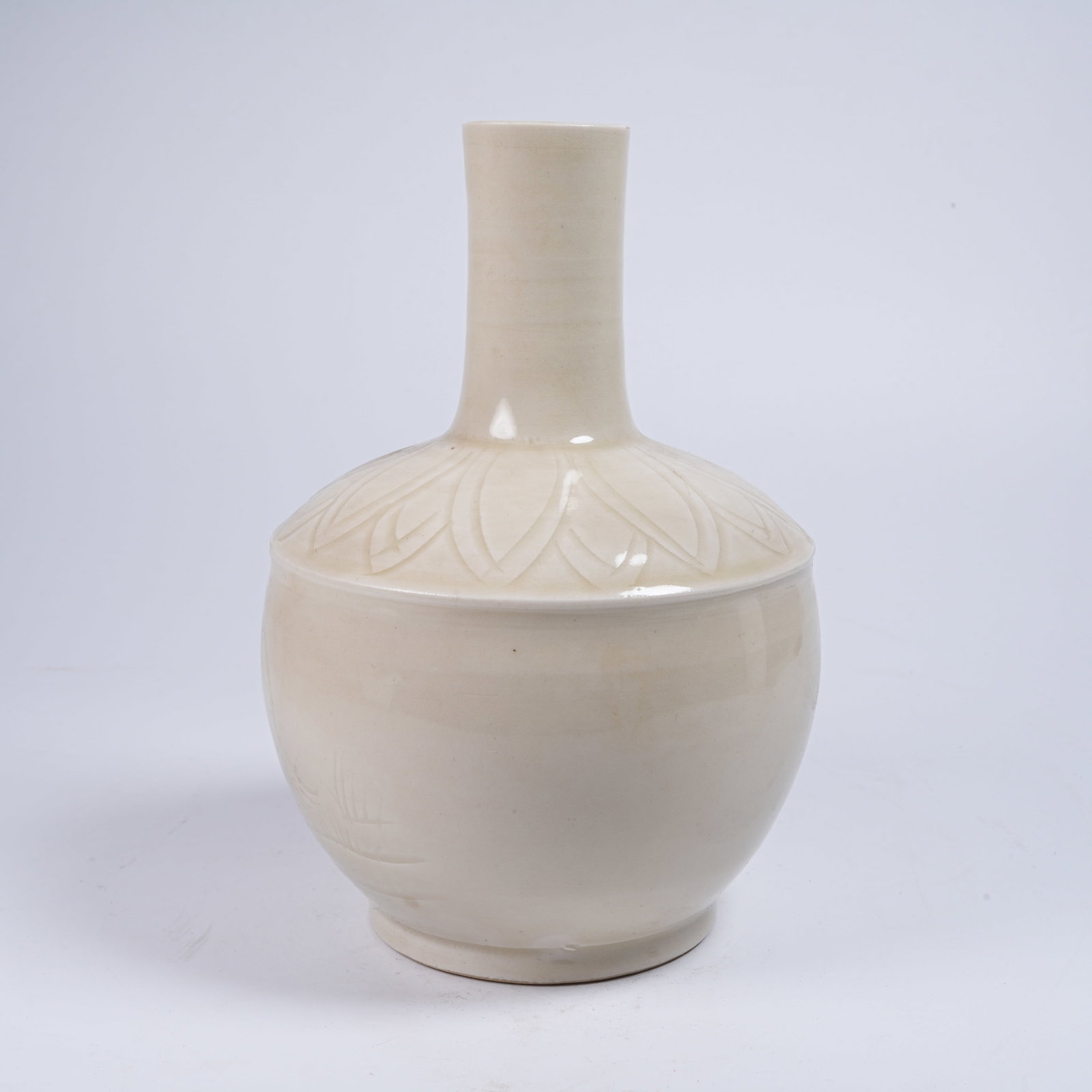 A DING KILN LONG-NECK VASE WITH RECUMBENT BEAST PATTERN (1 of 9)
