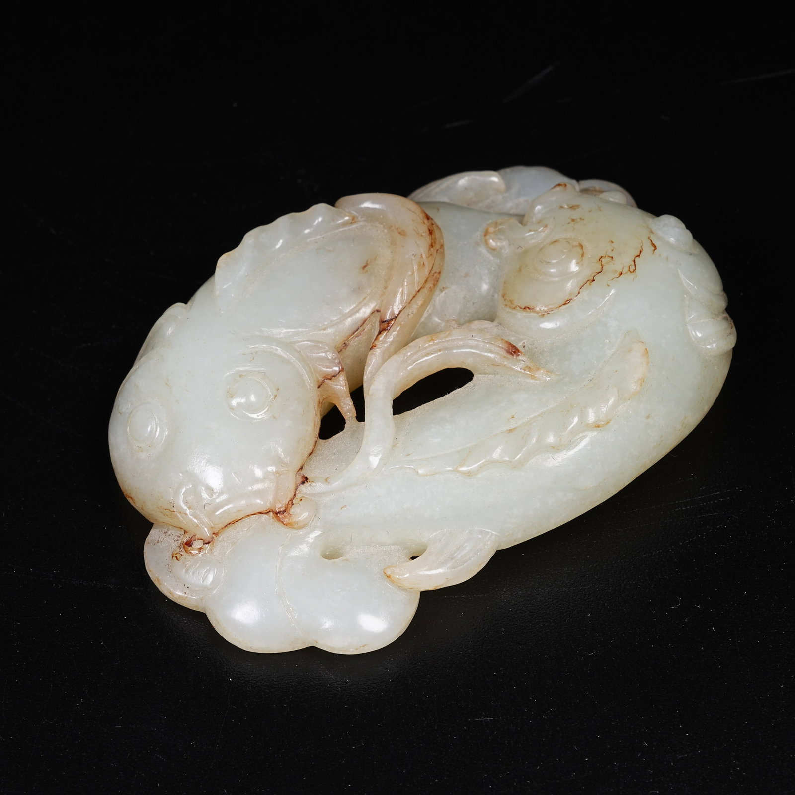 A HETIAN JADE PENDANT WITH SURPLUS YEAR AFTER YEAR MOTIF: Hetian Jade Pendant with Surplus Year after Year Motif