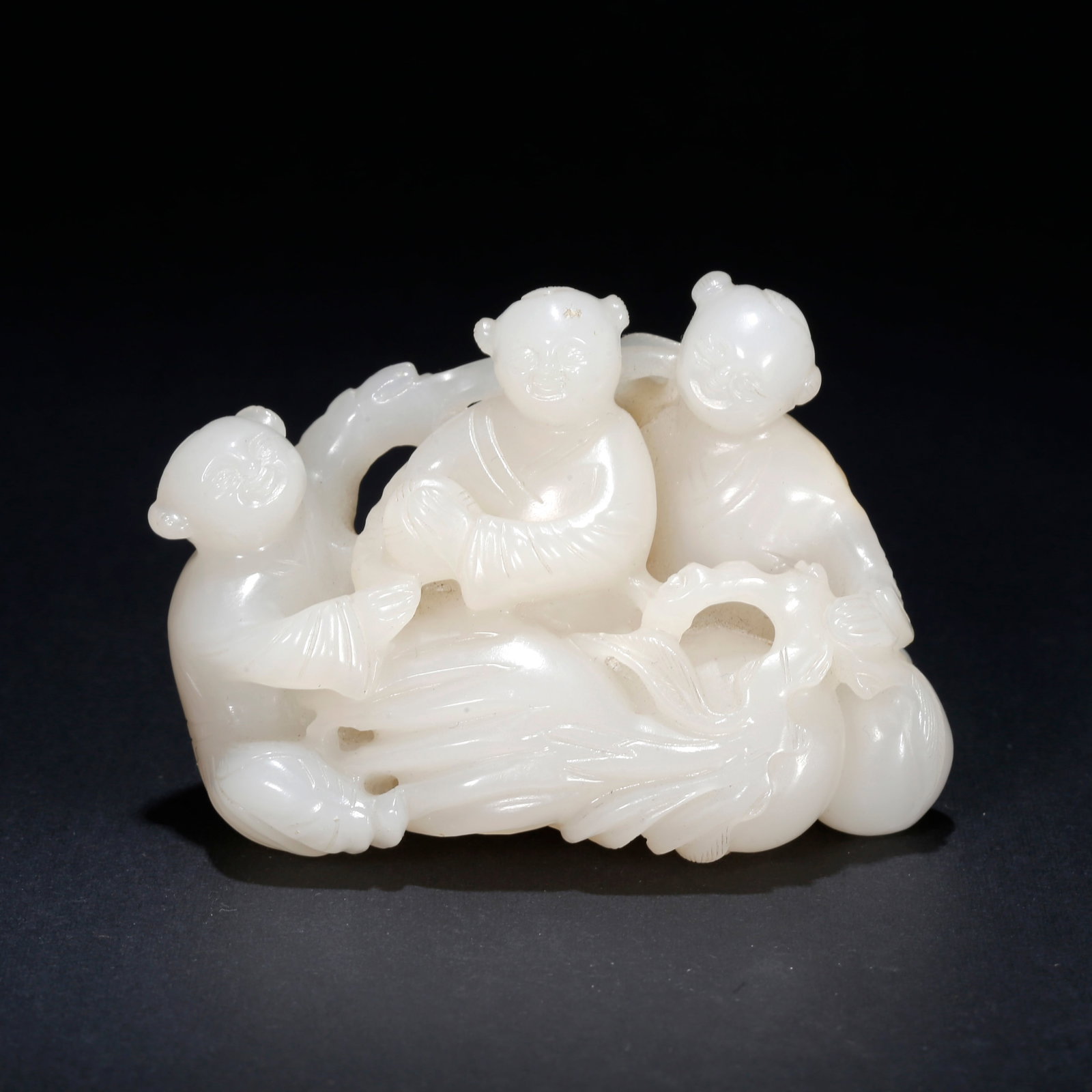A HETIAN JADE CARVED BOY ORNAMENT (1 of 9)