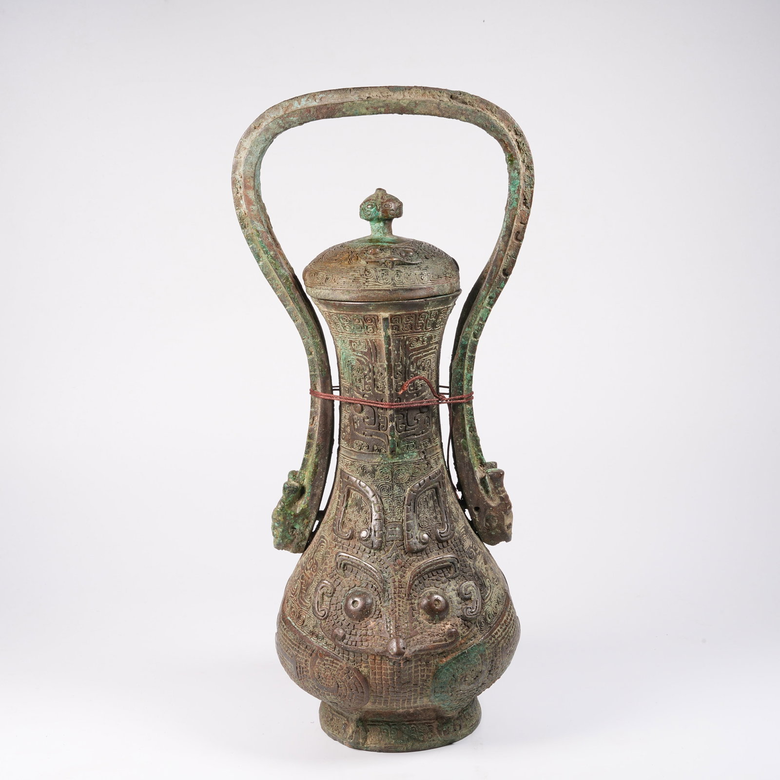 A BRONZE LOOP-HANDLED YOU VESSEL WITH BEAST MASK PATTERN (1 of 10)