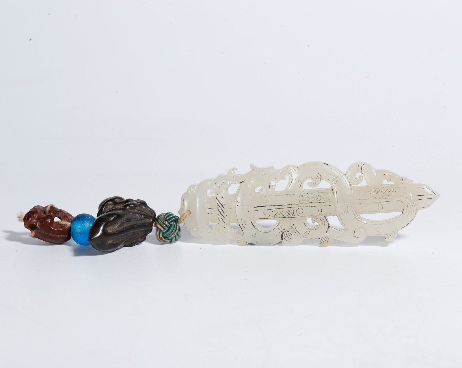A HETIAN JADE CARVED RITUAL IMPLEMENT: Hetian Jade Carved Ritual Implement