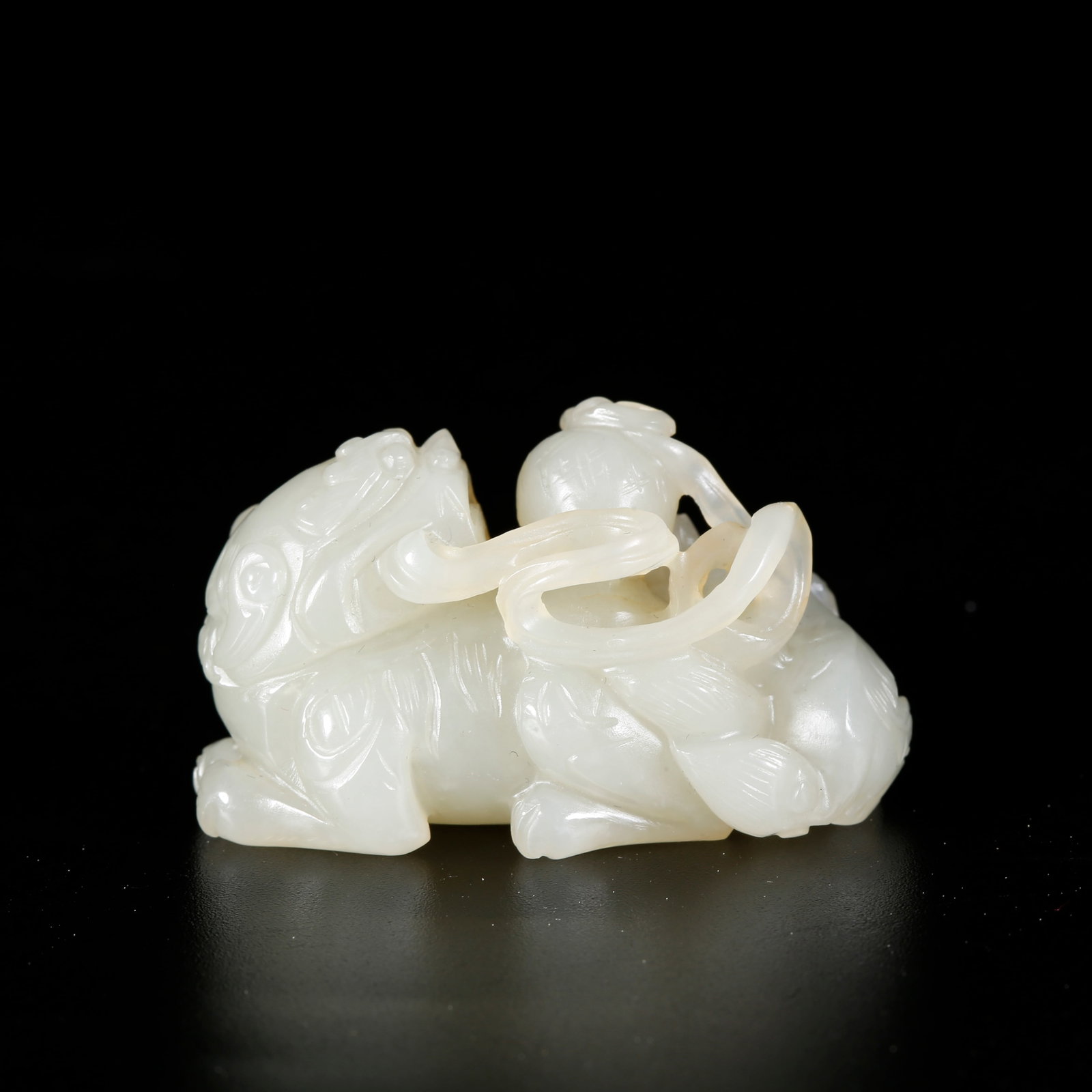 A HETIAN JADE ORNAMENT OF LIONS ROLLING EMBROIDERED BALLS: Hetian Jade Ornament of Lions Rolling Embroidered Balls