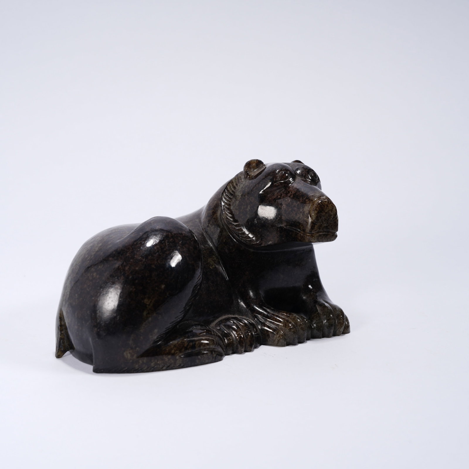 A ANCIENT JADE RECUMBENT BEAR ORNAMENT: Ancient jade recumbent bear ornament