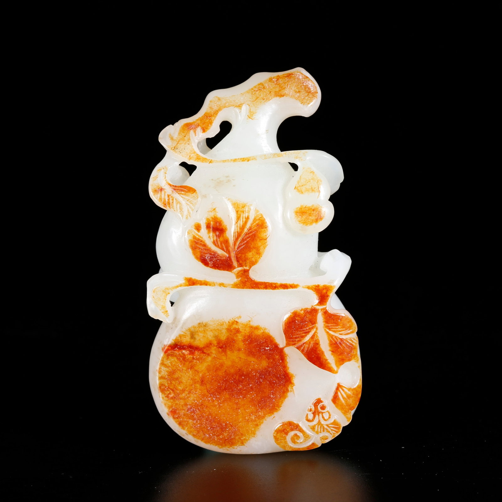A HETIAN JADE GOURD-SHAPED ORNAMENT: Hetian Jade Gourd-shaped Ornament