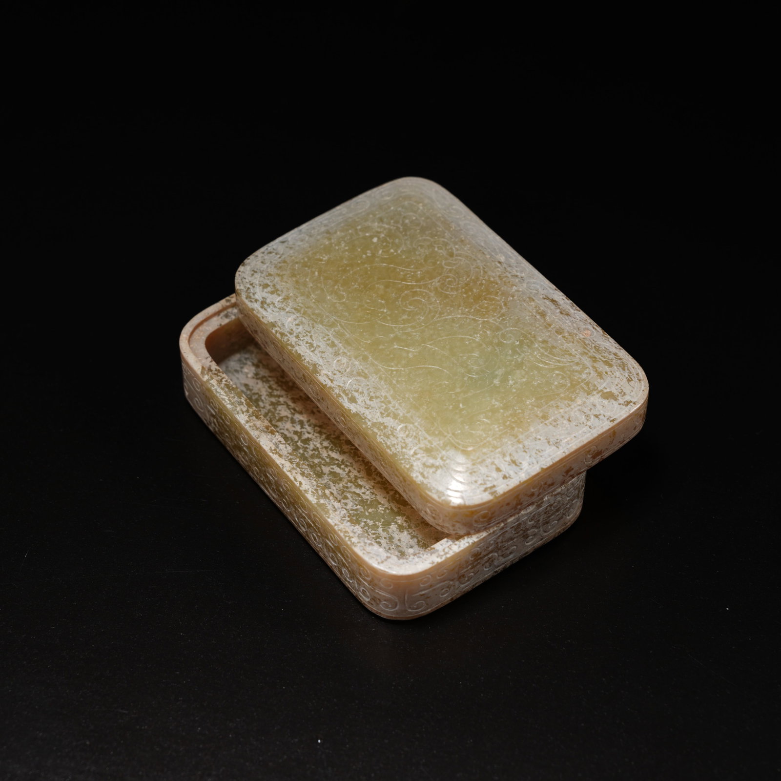 A ANCIENT JADE SQUARE LIDDED BOX WITH PHOENIX MOTIF: Ancient jade square lidded box with phoenix motif