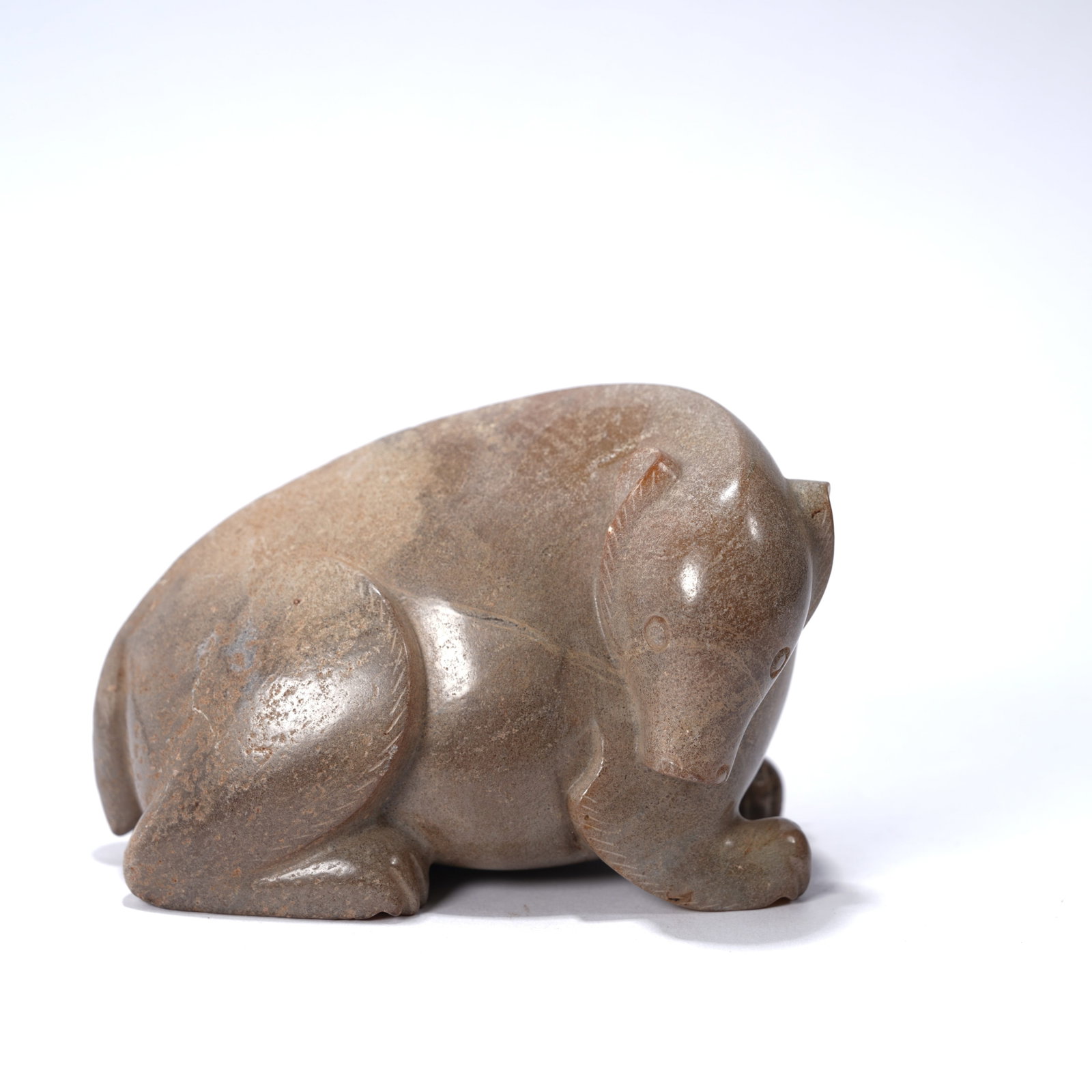 A ANCIENT JADE RECUMBENT BEAR ORNAMENT: Ancient jade recumbent bear ornament