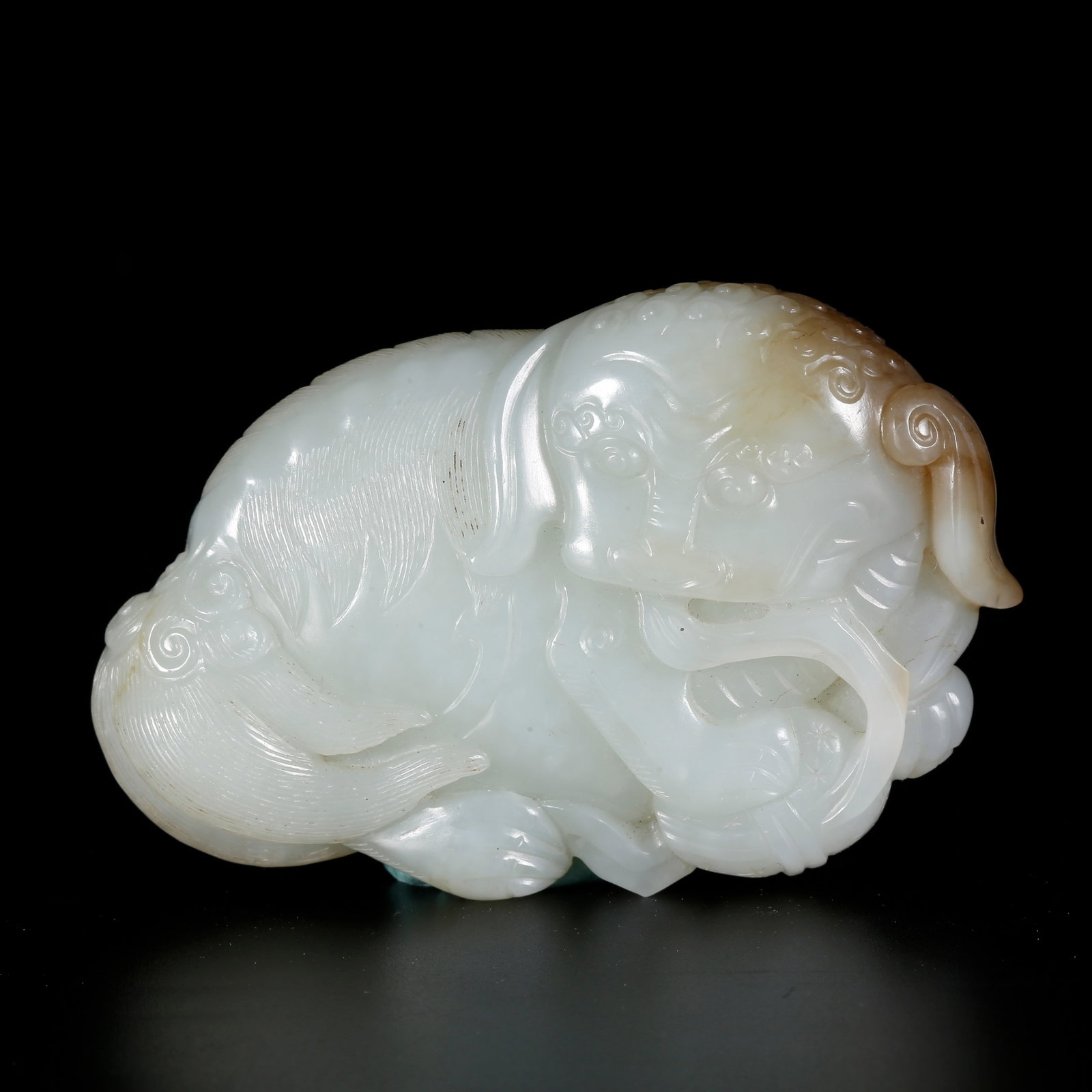 A HETIAN JADE ORNAMENT WITH LIONS ROLLING EMBROIDERED BALLS PATTERN: Hetian Jade Ornament with Lions Rolling Embroidered Balls Pattern
