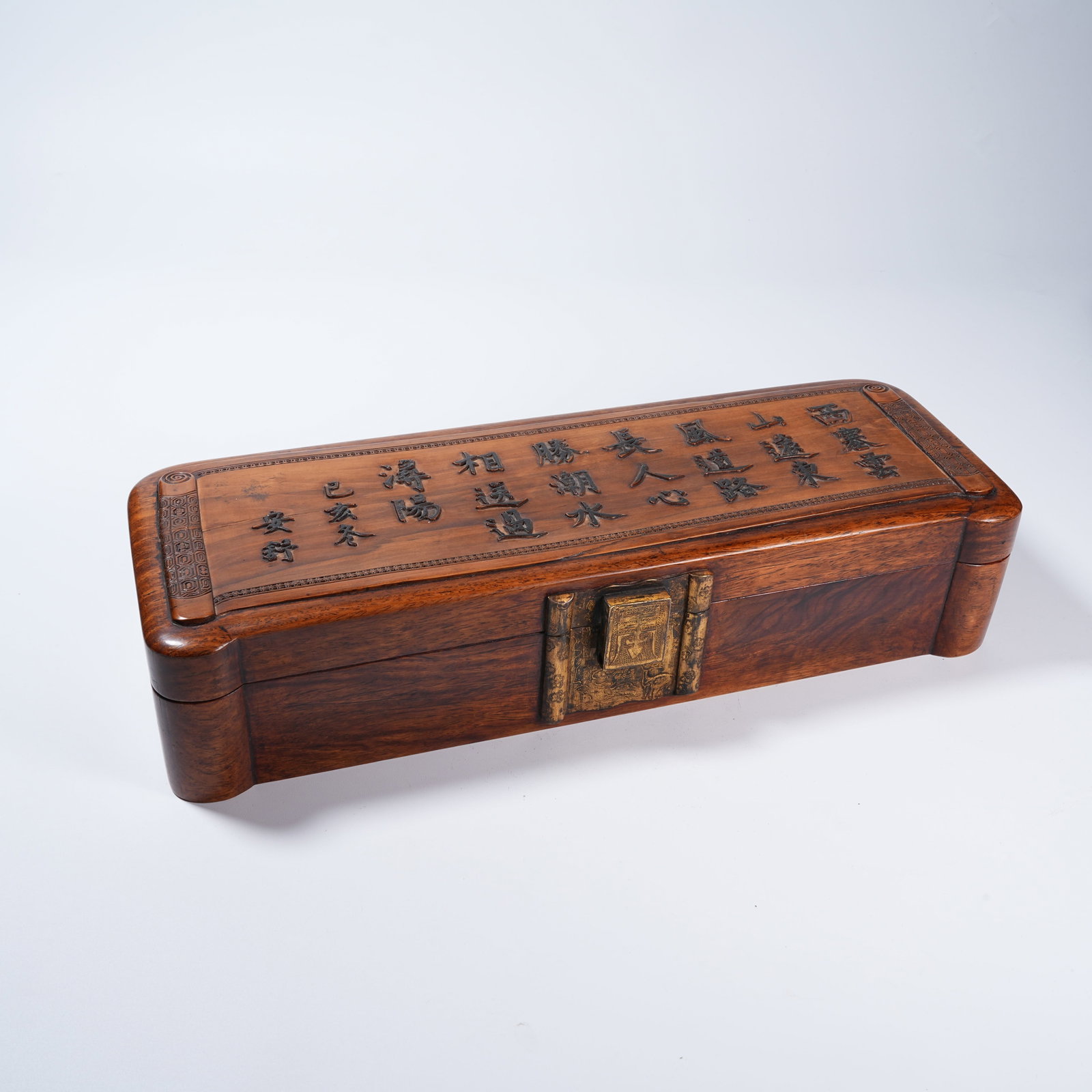 A HUANGHUALI LONG COVERED BOX CARVED WITH POEM INSCRIPTION: Huanghuali Long Covered Box Carved with Poem Inscription