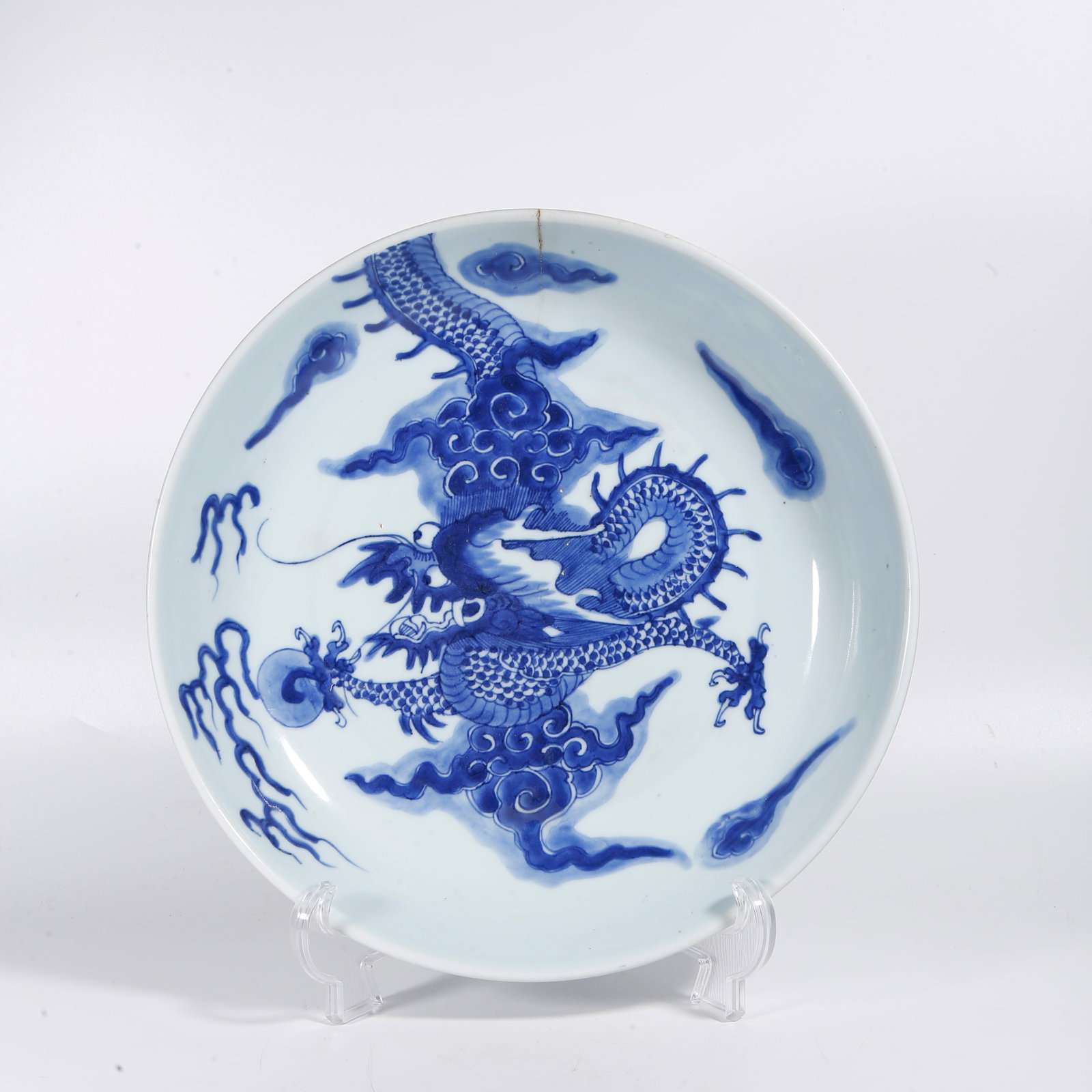 A BLUE AND WHITE PLATE WITH CLOUD AND DRAGON PATTERN (1 of 10)
