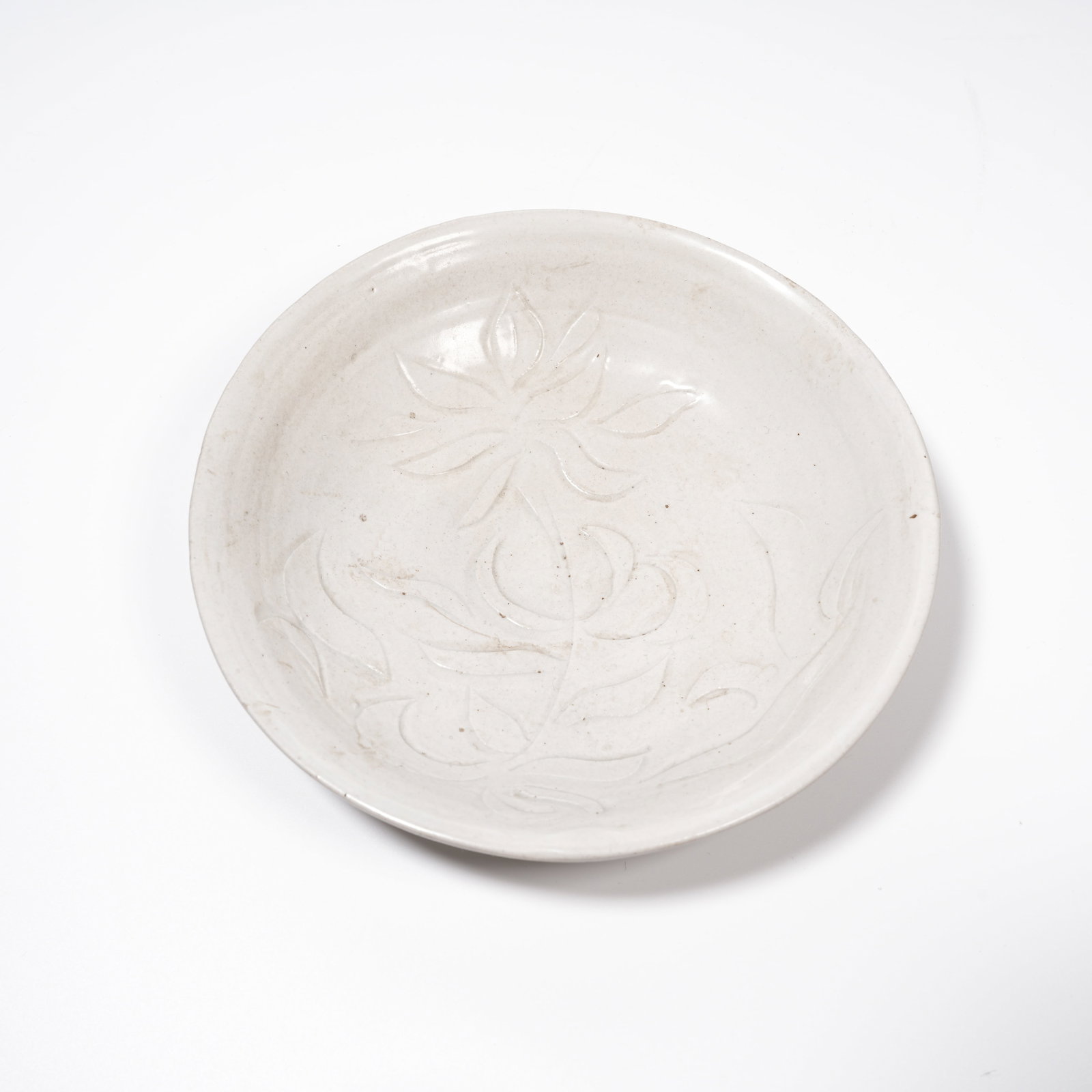 A DING KILN FLORAL PATTERN PLATE (1 of 9)