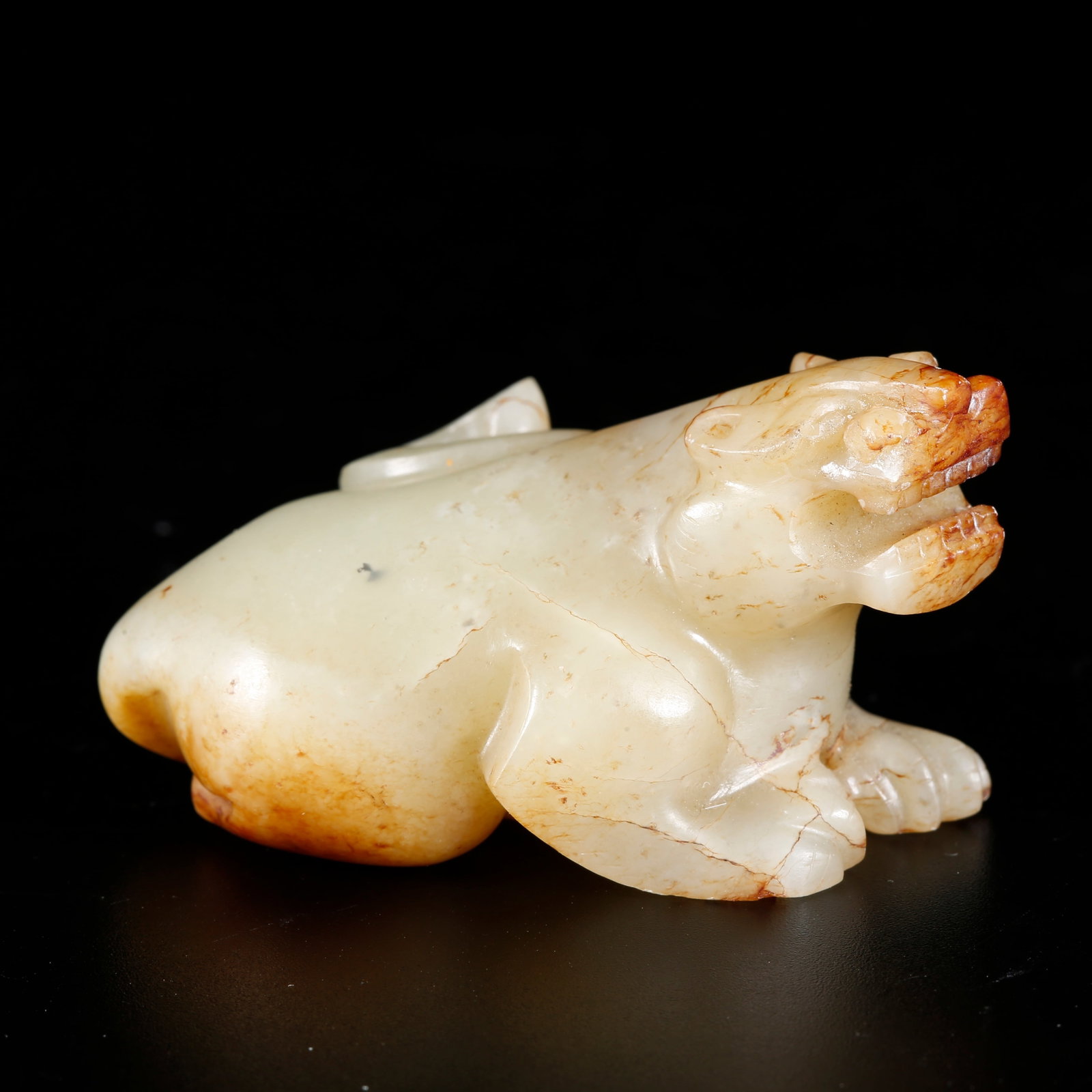 A BEAST-SHAPED ORNAMENT CARVED FROM HETIAN JADE (1 of 10)