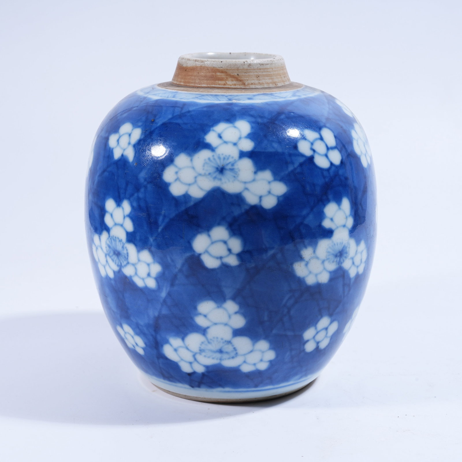 A BLUE AND WHITE JAR WITH RESERVED FLORAL PATTERN: Blue and White Jar with Reserved Floral Pattern
