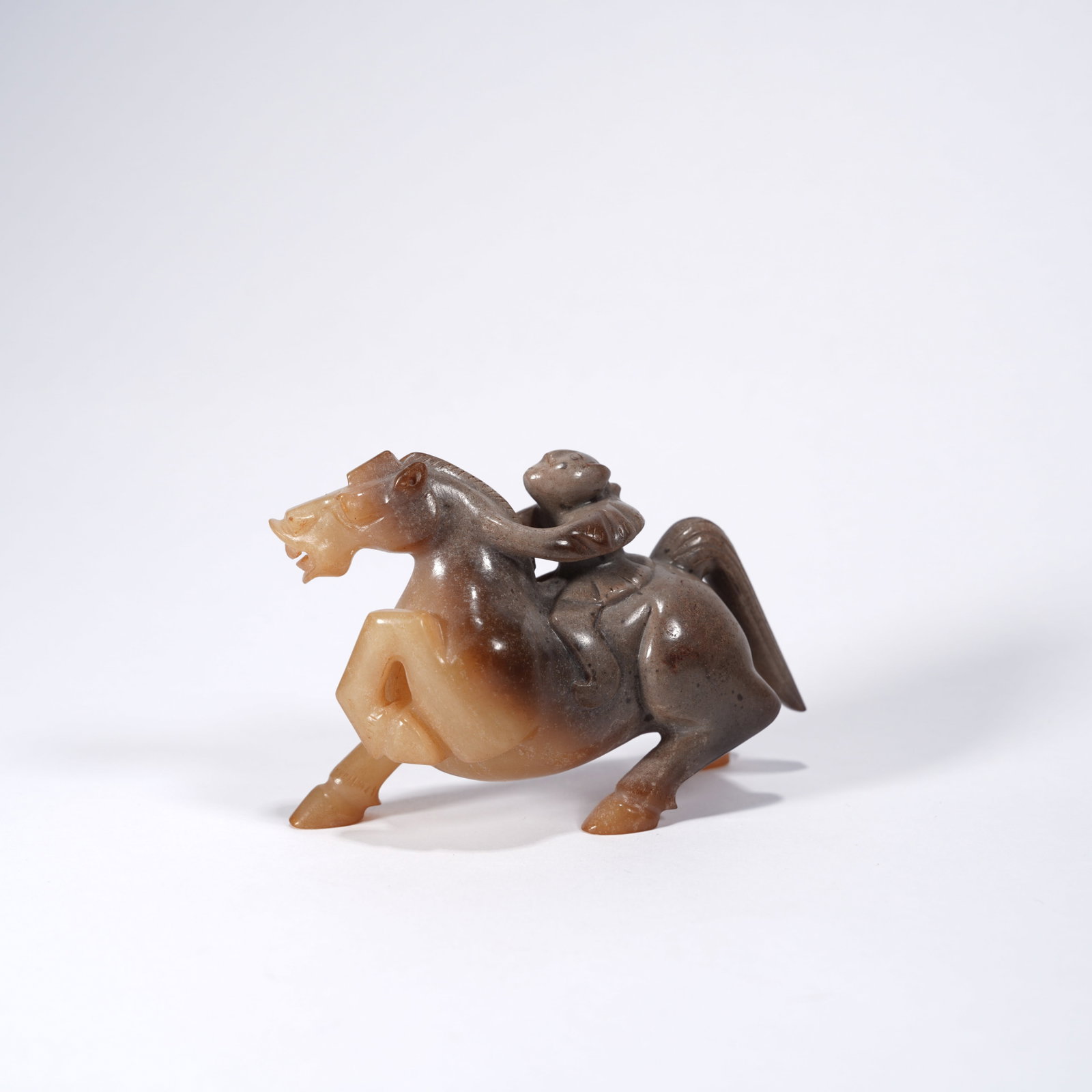 A ANCIENT JADE WINGED FIGURE RIDING BEAST ORNAMENT (1 of 5)