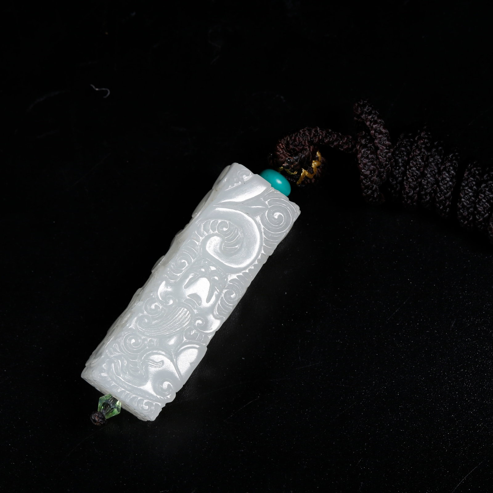 A DRAGON-PATTERNED CYLINDRICAL PENDANT CARVED FROM HETIAN JADE (1 of 8)