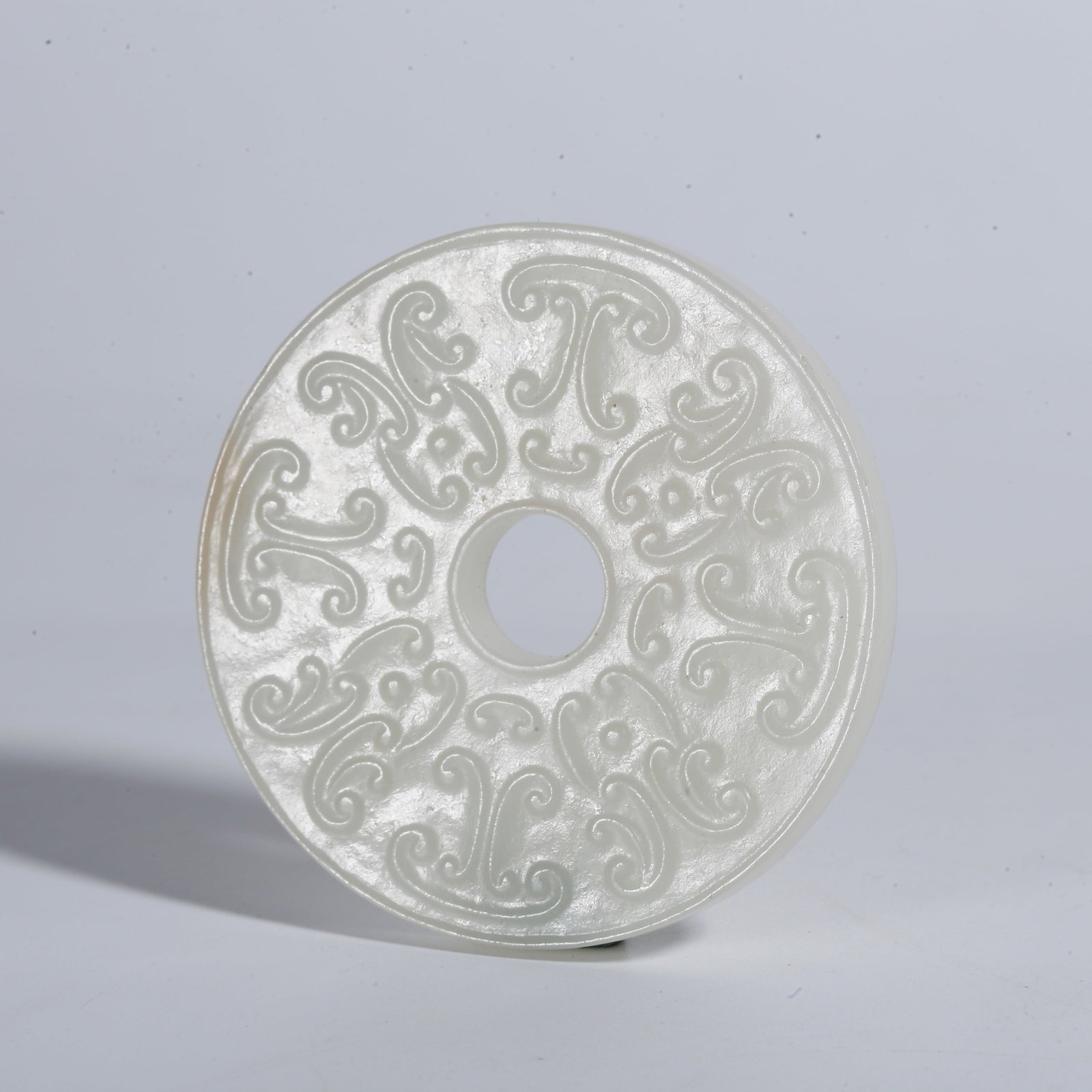 A HETIAN JADE CARVED MINIATURE LINKED BI DISC (1 of 9)