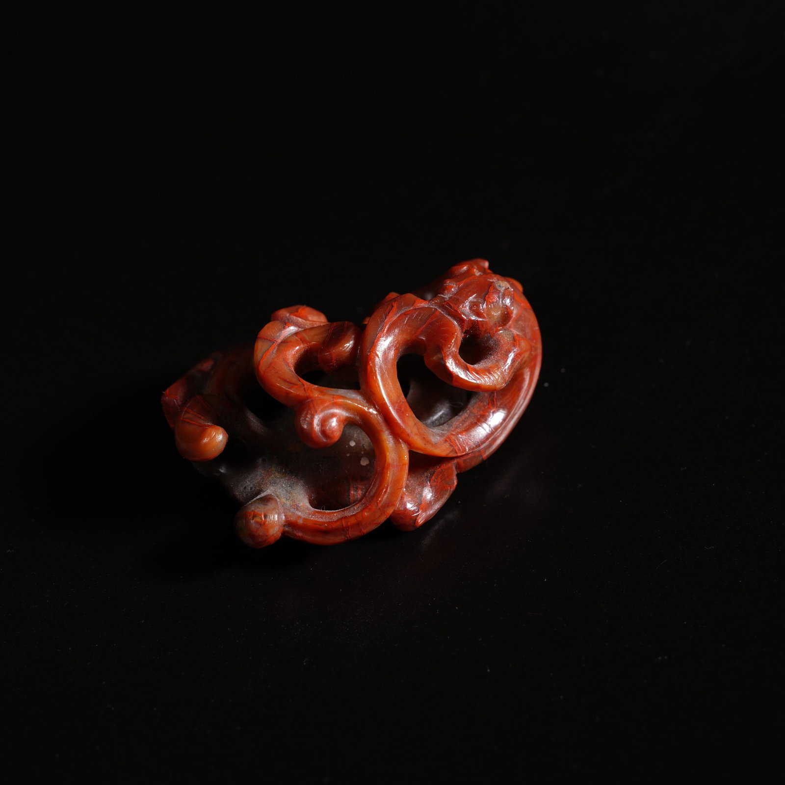 A WARRING STATES RED AGATE OPENWORK DOUBLE-DRAGON "CHICKEN-HEART" PENDANT (1 of 5)