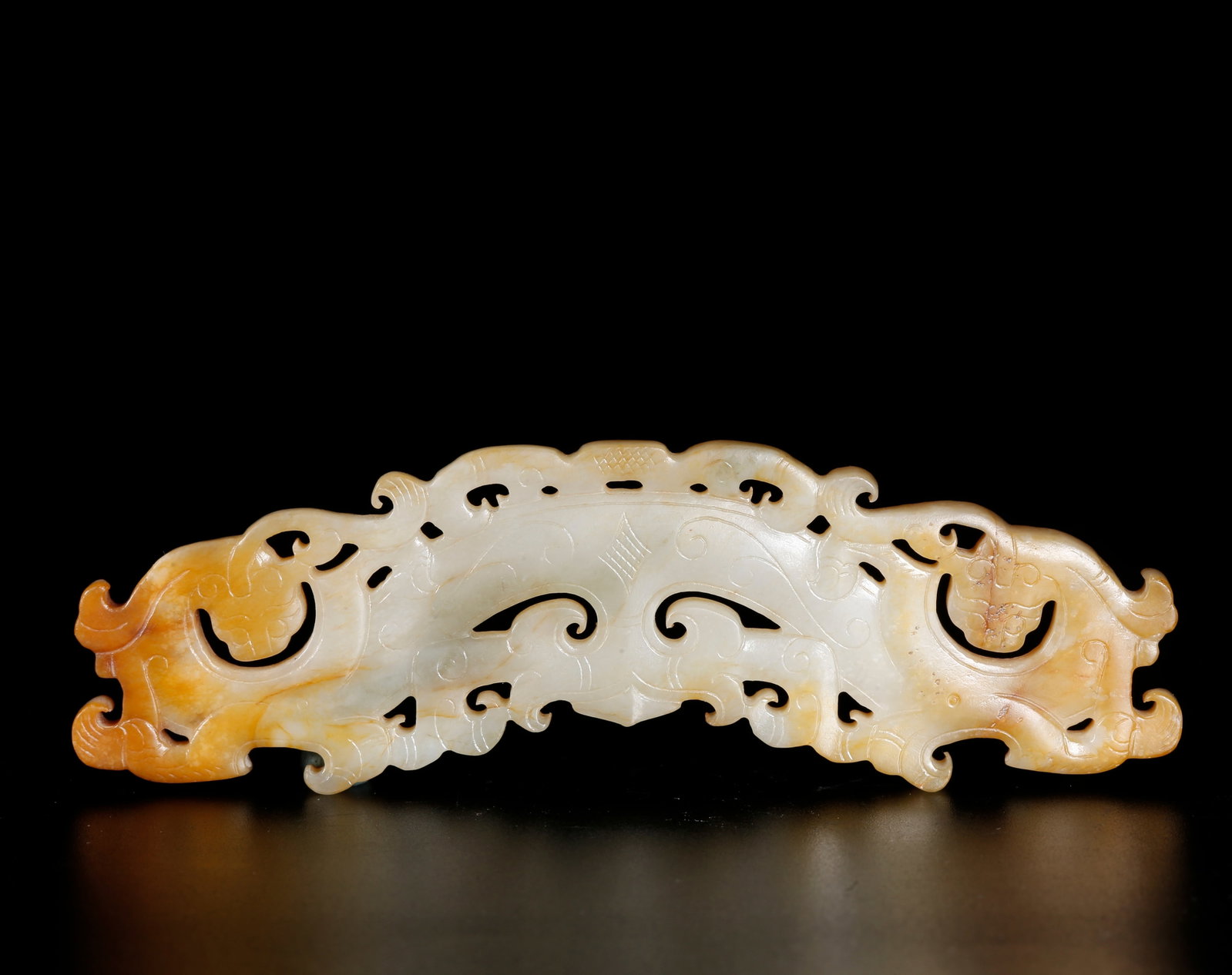 A DRAGON-SHAPED JADE HUANG CARVED FROM HETIAN JADE (1 of 10)