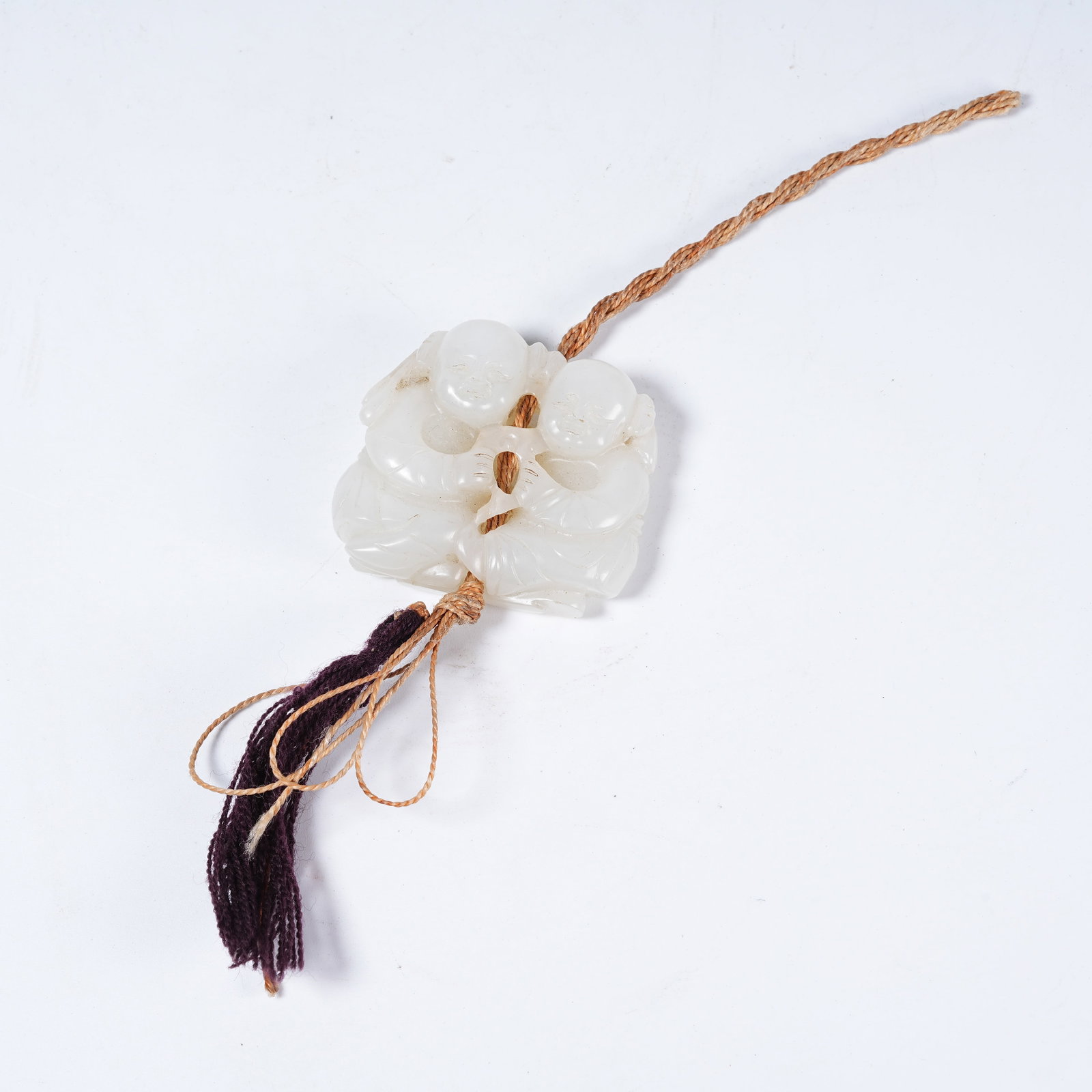 A HETIAN WHITE JADE PENDANT OF HE-HE IMMORTALS (1 of 9)