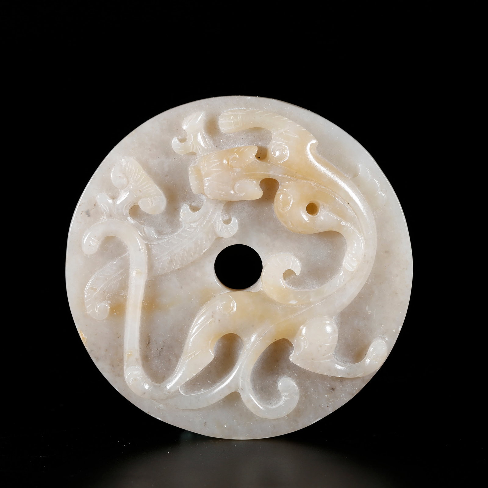 A DRAGON-PATTERNED BI DISC CARVED FROM HETIAN JADE: Dragon-patterned Bi Disc Carved from Hetian Jade