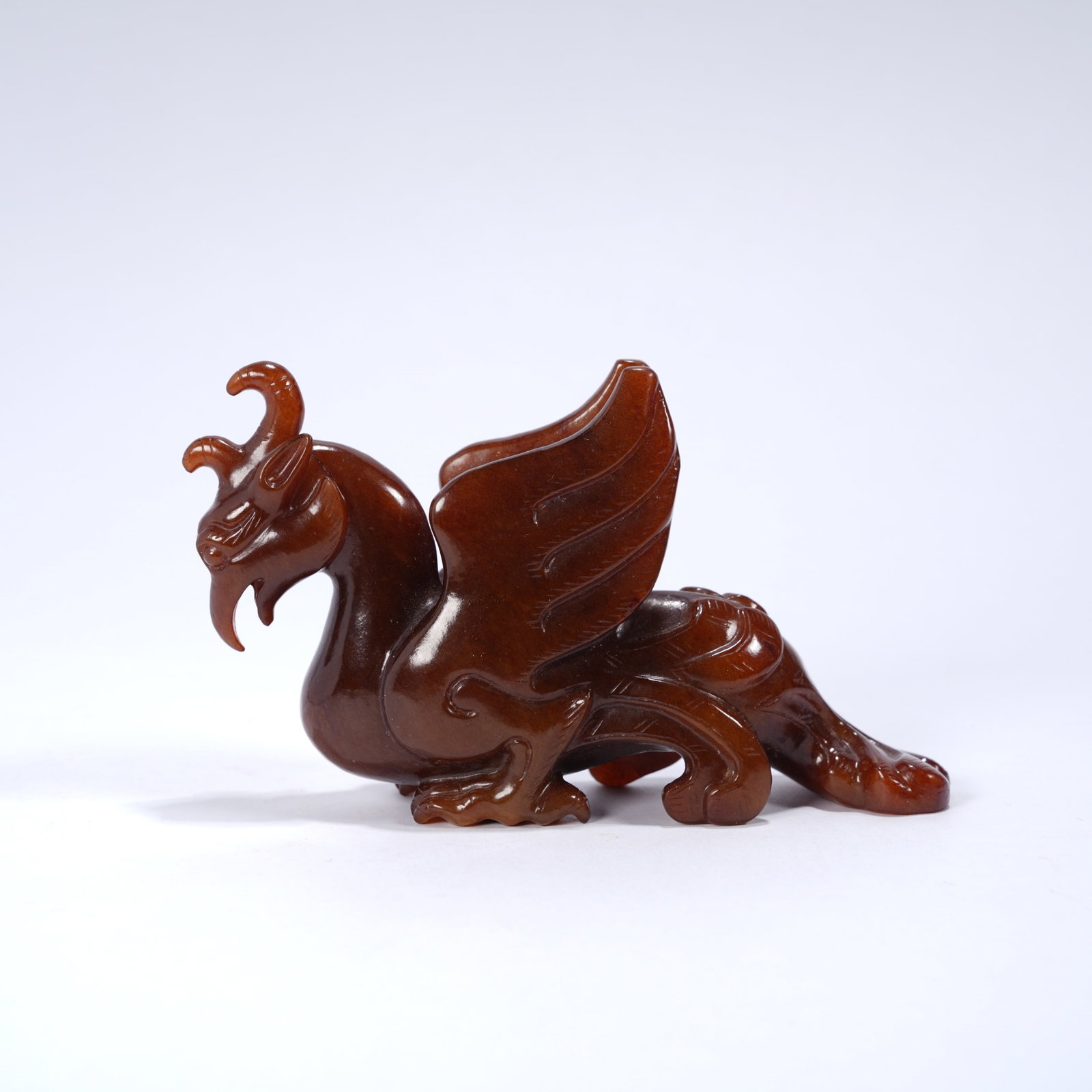 A ANCIENT JADE PHOENIX-BIRD ORNAMENT: Ancient jade phoenix-bird ornament