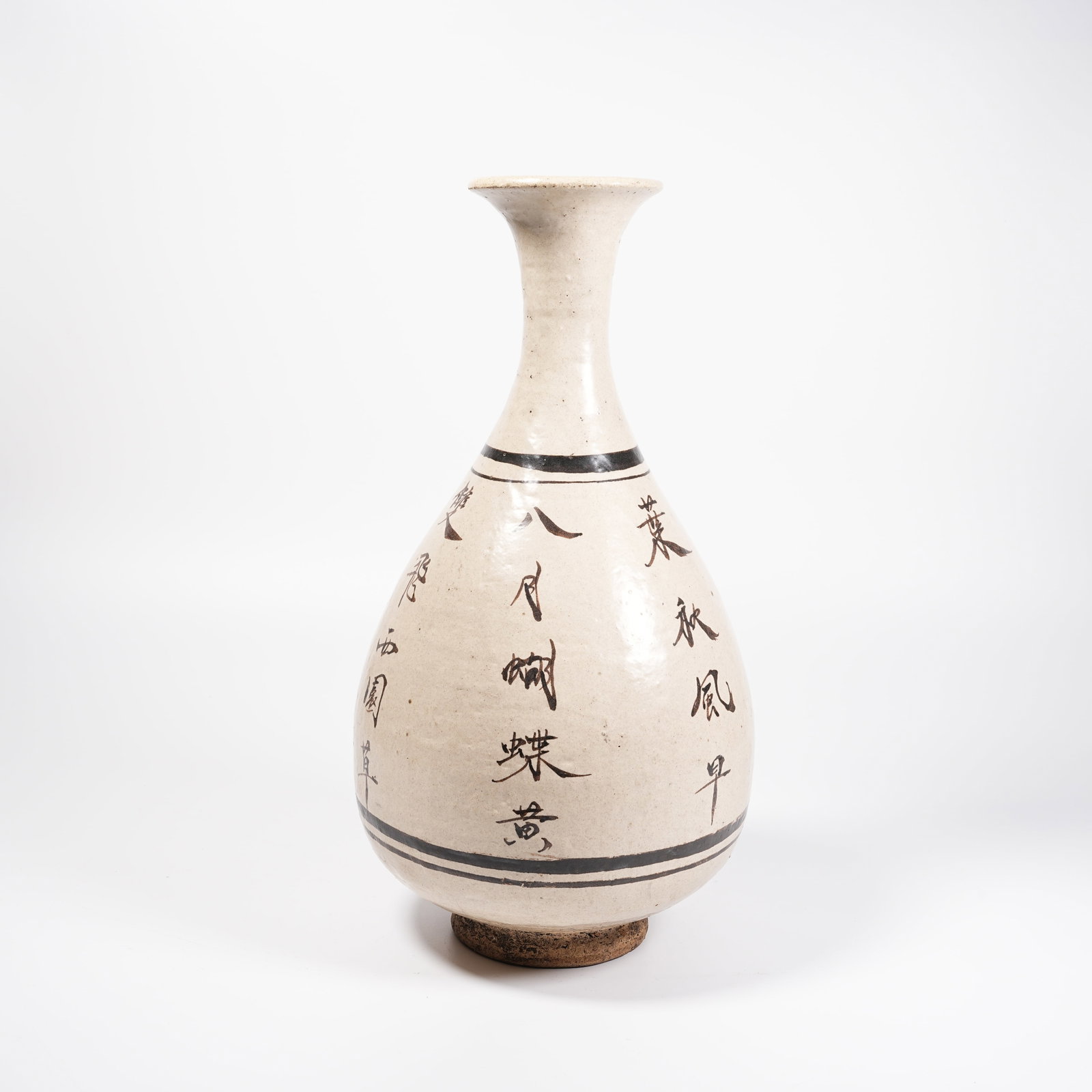 A CIZHOU KILN POEM-CARVED PEAR-SHAPED VASE: Cizhou Kiln Poem-carved Pear-shaped Vase